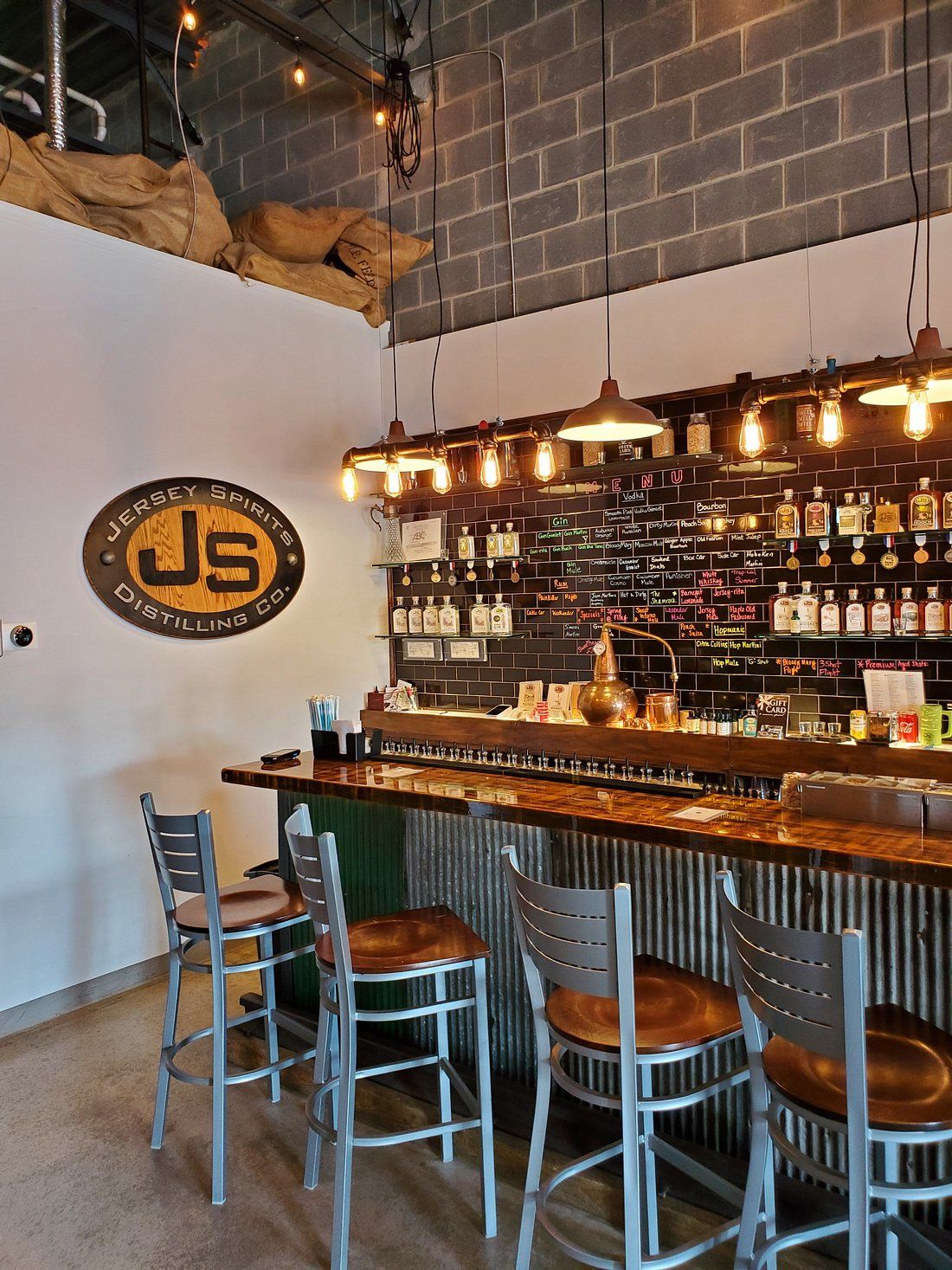 The tasting room at Jersey Spirits Distilling Co. in Fairfield, New Jersey, featuring handcrafted spirits and an industrial-style bar.