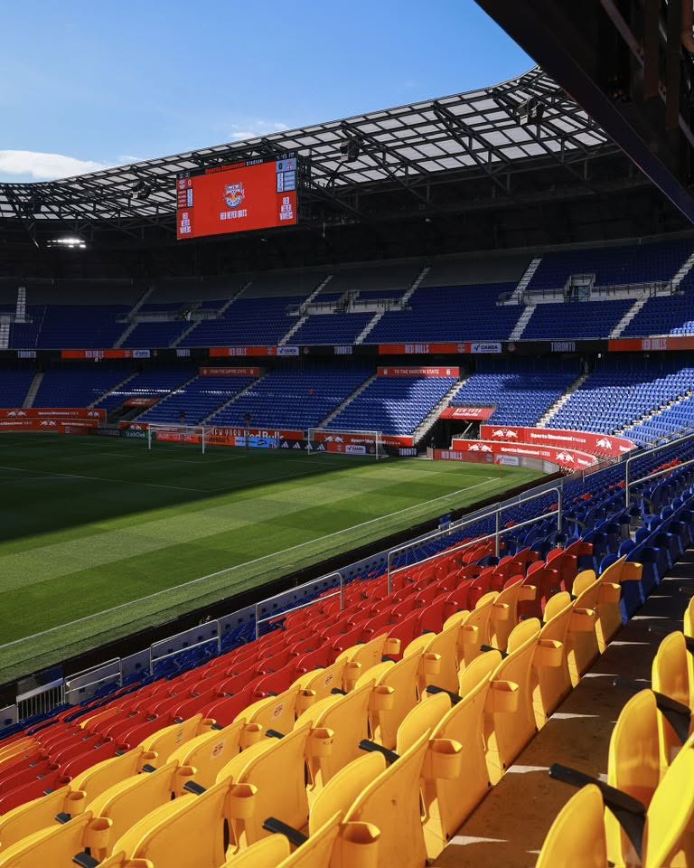 Sports Illustrated Stadium in Harrison, New Jersey, home of the New York Red Bulls, featuring colorful stadium seating and the soccer field.