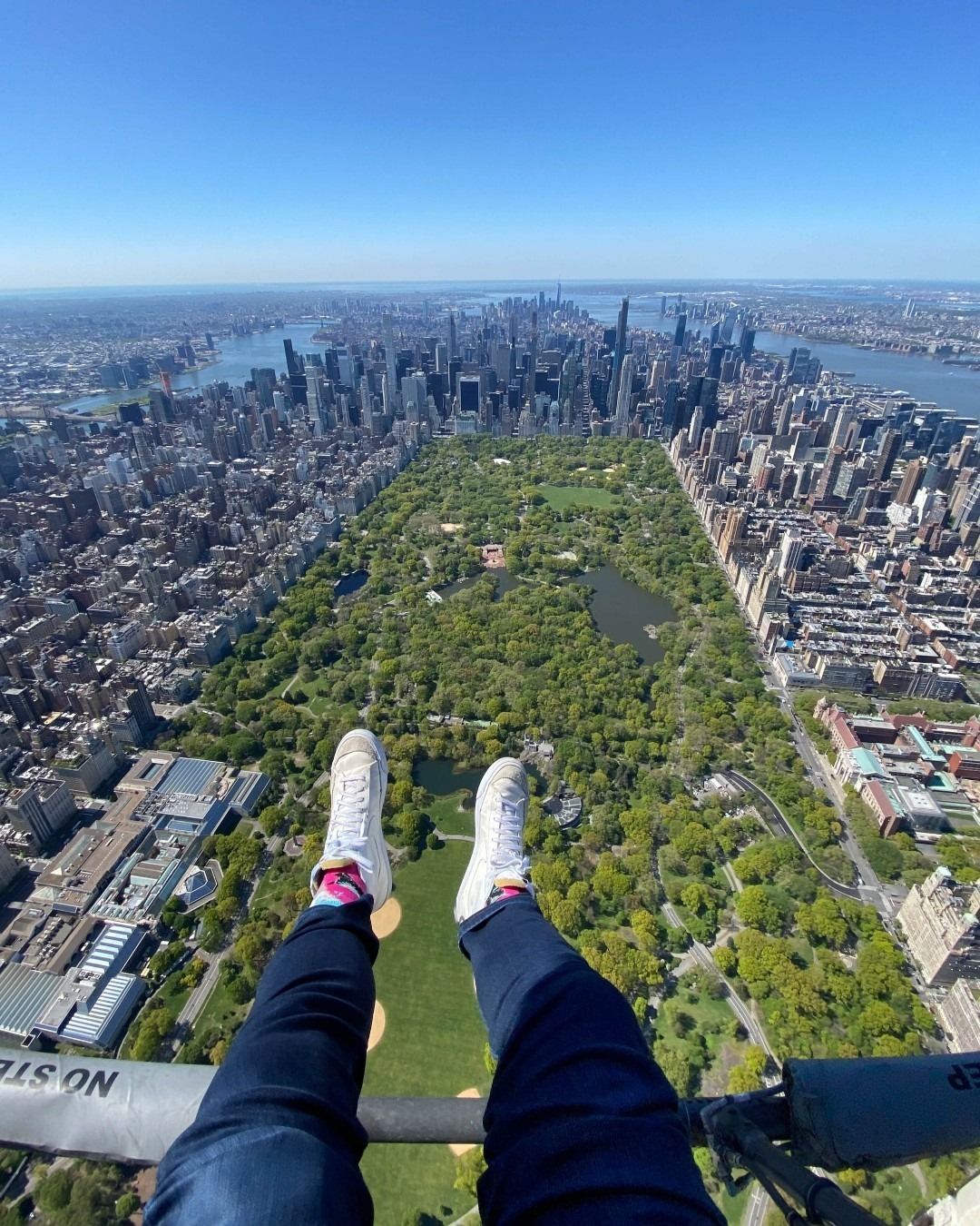 An aerial view above Central Park with the Manhattan skyline visible in the distance, highlighting Kearny, New Jersey's close proximity to New York City.
