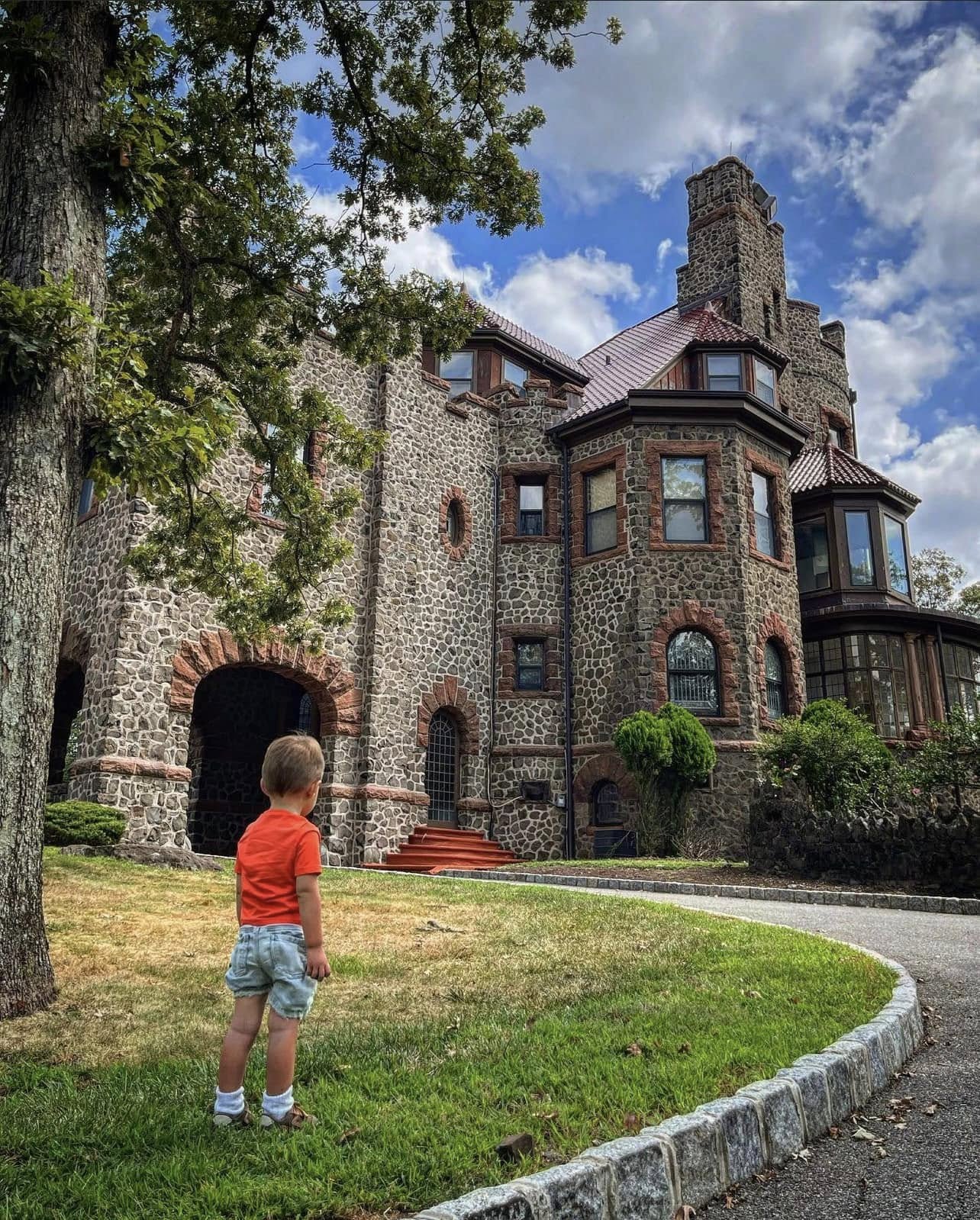 Kip's Castle Park in Verona, New Jersey, showcasing the historic stone mansion surrounded by landscaped grounds.