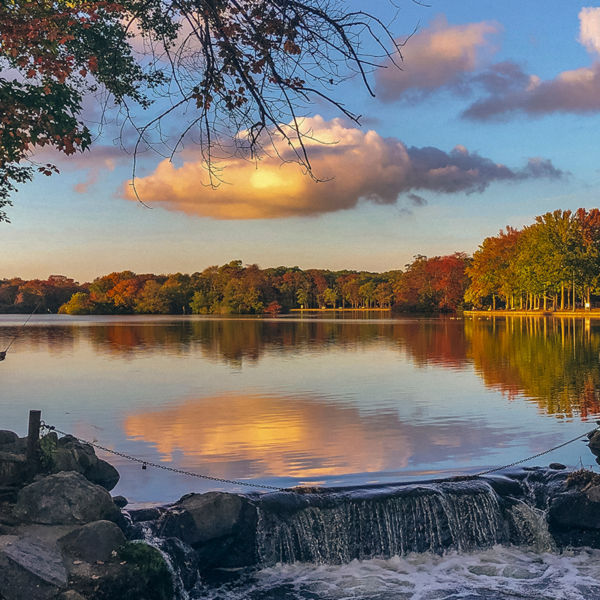 Scenic waterfront view at Lake Ronkonkoma near Centereach, New York, featuring calm reflective water, autumn foliage, and a peaceful natural setting that highlights the area’s outdoor beauty and Long Island charm.