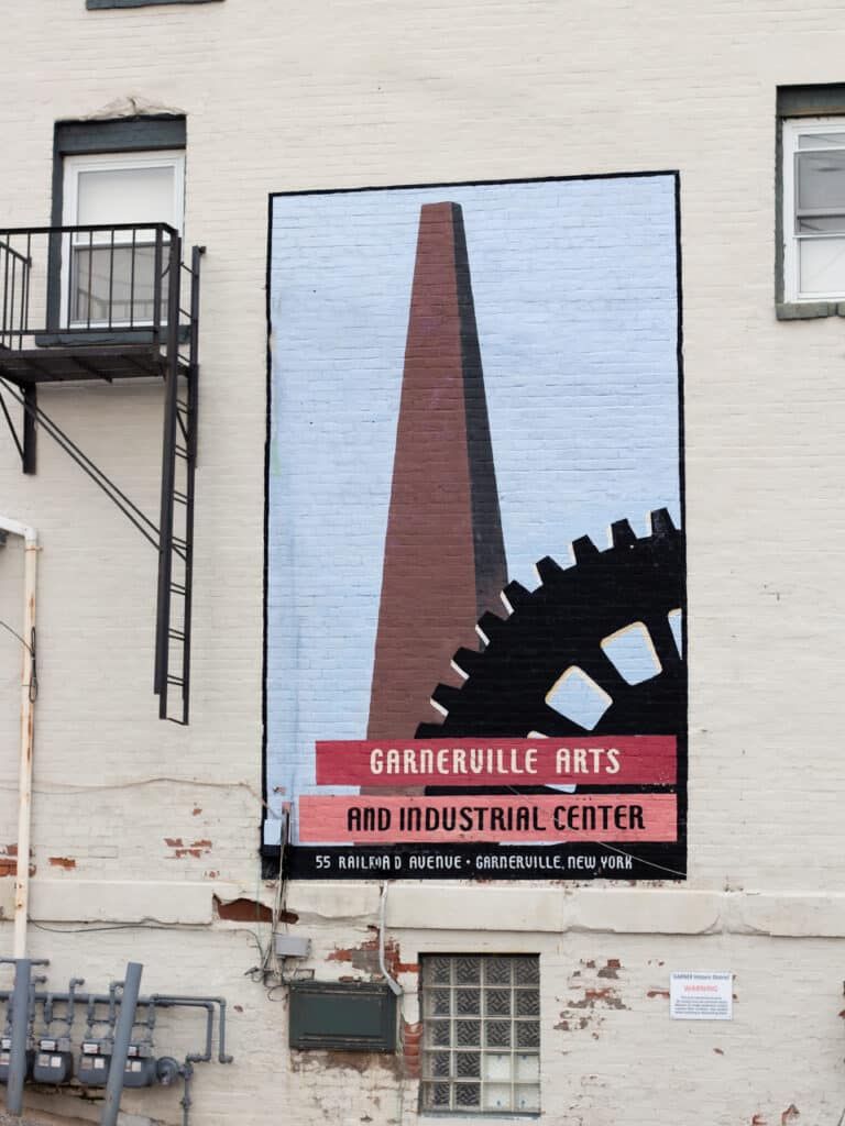 Garnerville Arts and Industrial Center mural on a historic brick building at 55 Railroad Avenue in Garnerville, New York.