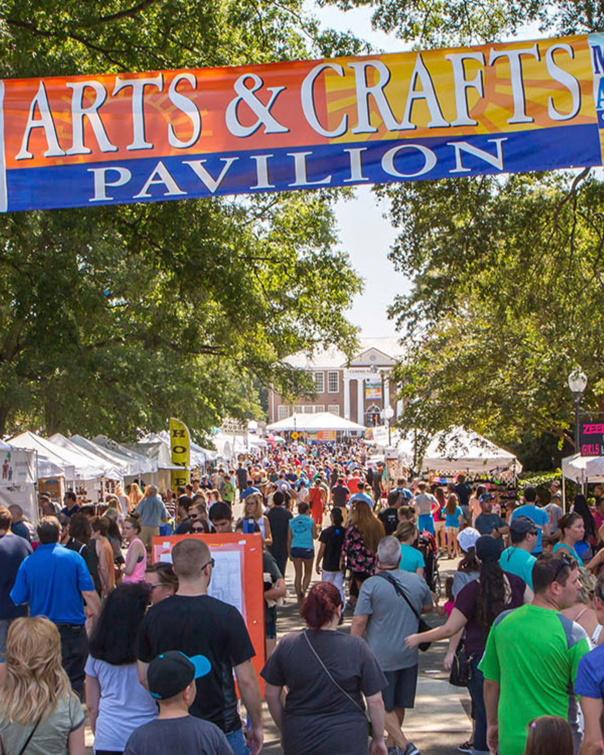 Bustling scene at the local Arts & Crafts Pavilion in downtown Matthews, NC