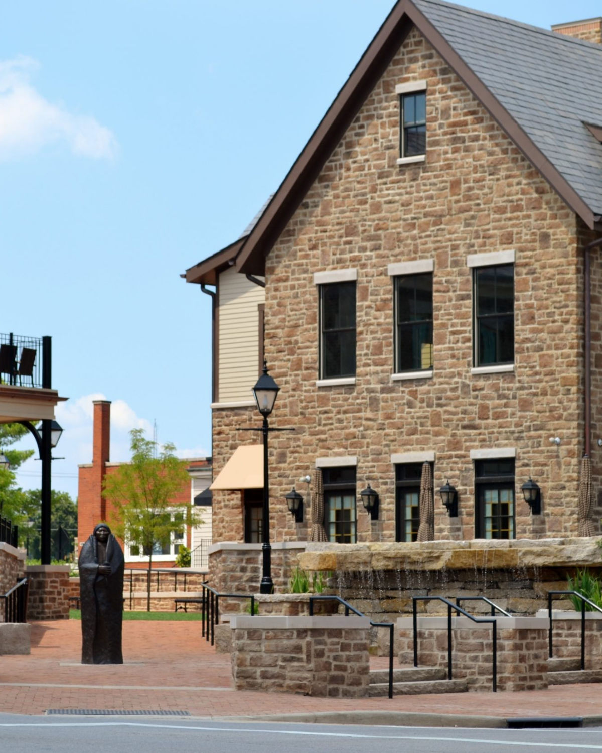 Historic stone building with outdoor cafe seating in charming downtown Dublin, Ohio