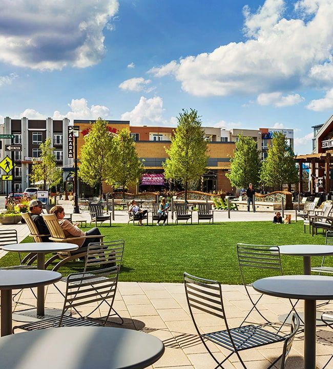 Outdoor dining and shopping area at King of Prussia Town Center in King of Prussia, Pennsylvania, featuring patio seating, modern storefronts, and a lively, walkable atmosphere—highlighting one of the region’s top lifestyle destinations for dining, retail, and community gatherings in Montgomery County.