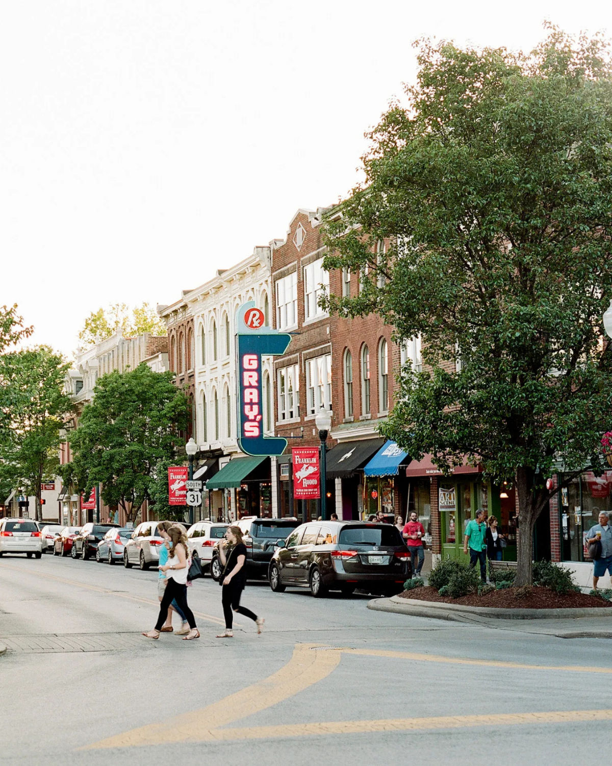 Residents crossing the street in the quaint downtown Franklin, TN historic district