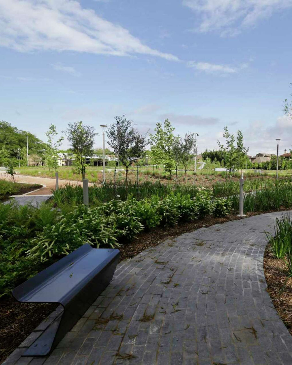 Evelyn's Park in Bellaire with open lawns, walking paths, and a calm neighborhood setting.