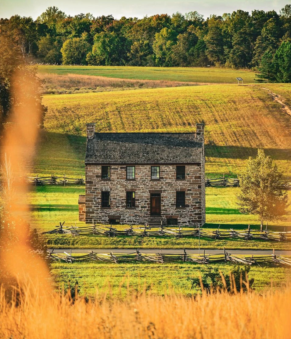 Historic stone farmhouse at Manassas National Battlefield Park in Manassas, Virginia, surrounded by open fields, split-rail fencing, and scenic countryside—capturing the region’s rich Civil War history, preserved landscapes, and one of Northern Virginia’s most significant cultural and outdoor heritage destinations.