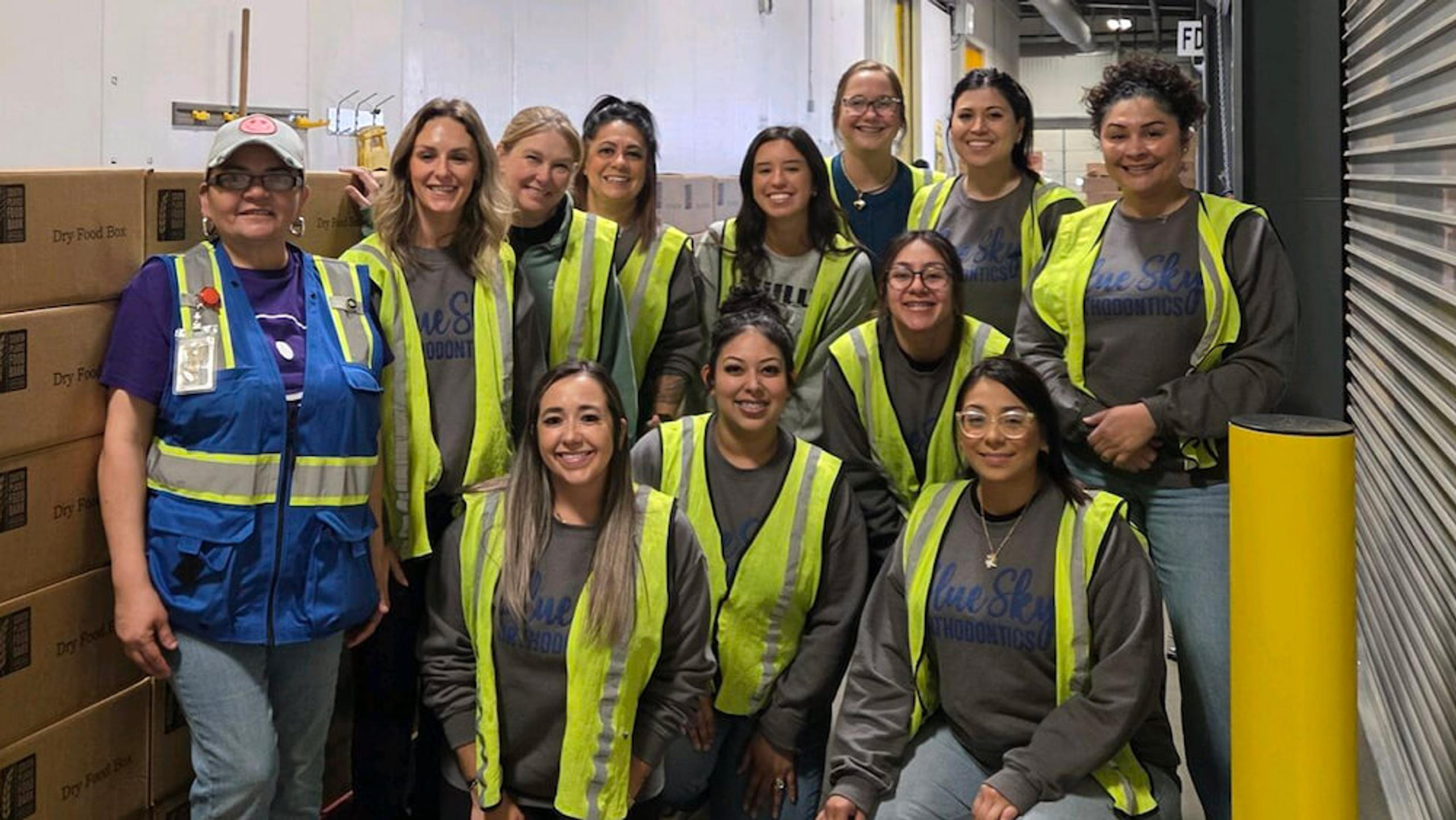 staff members volunteering at food bank