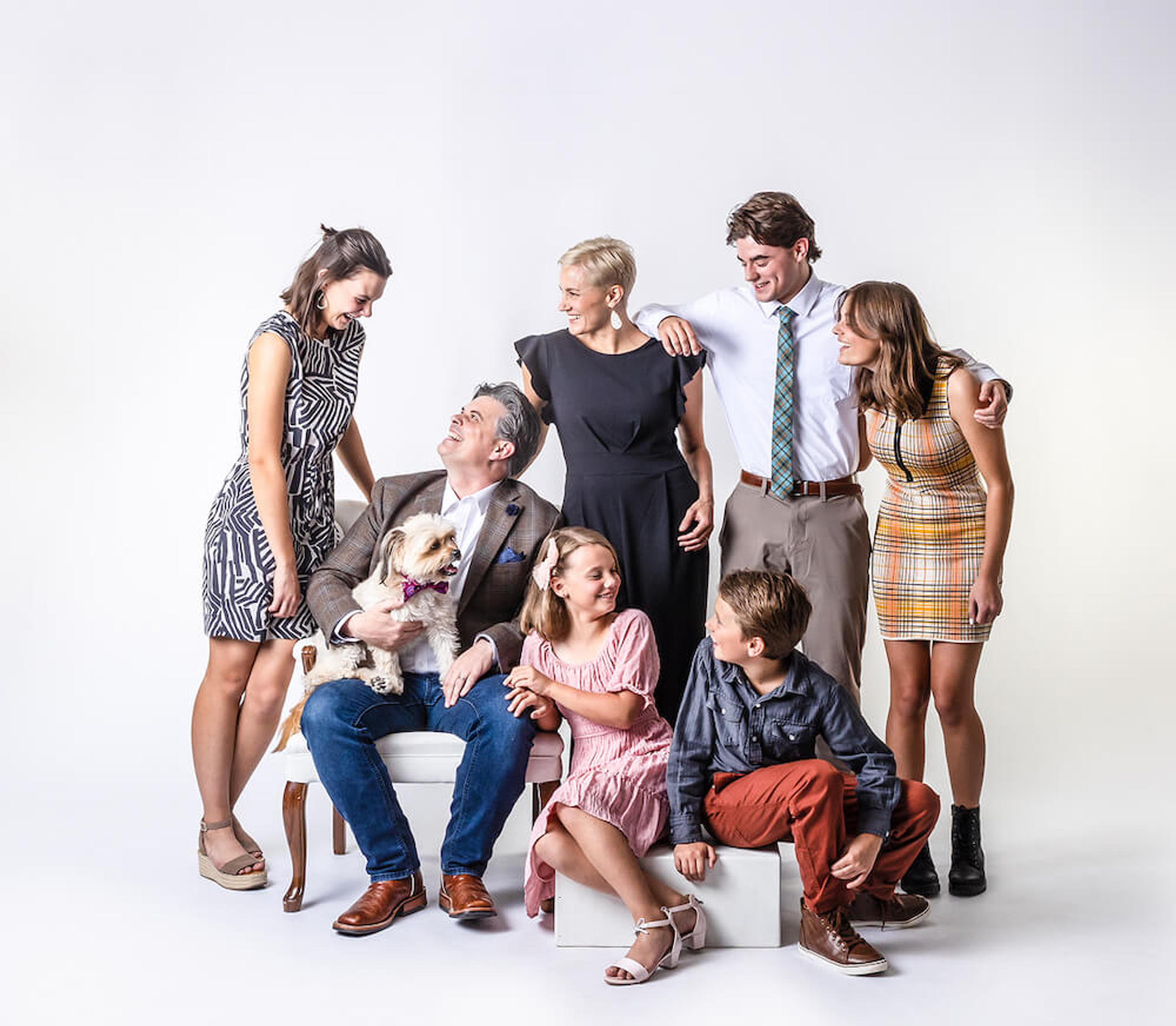 dr. ure and family smiling, sitting down