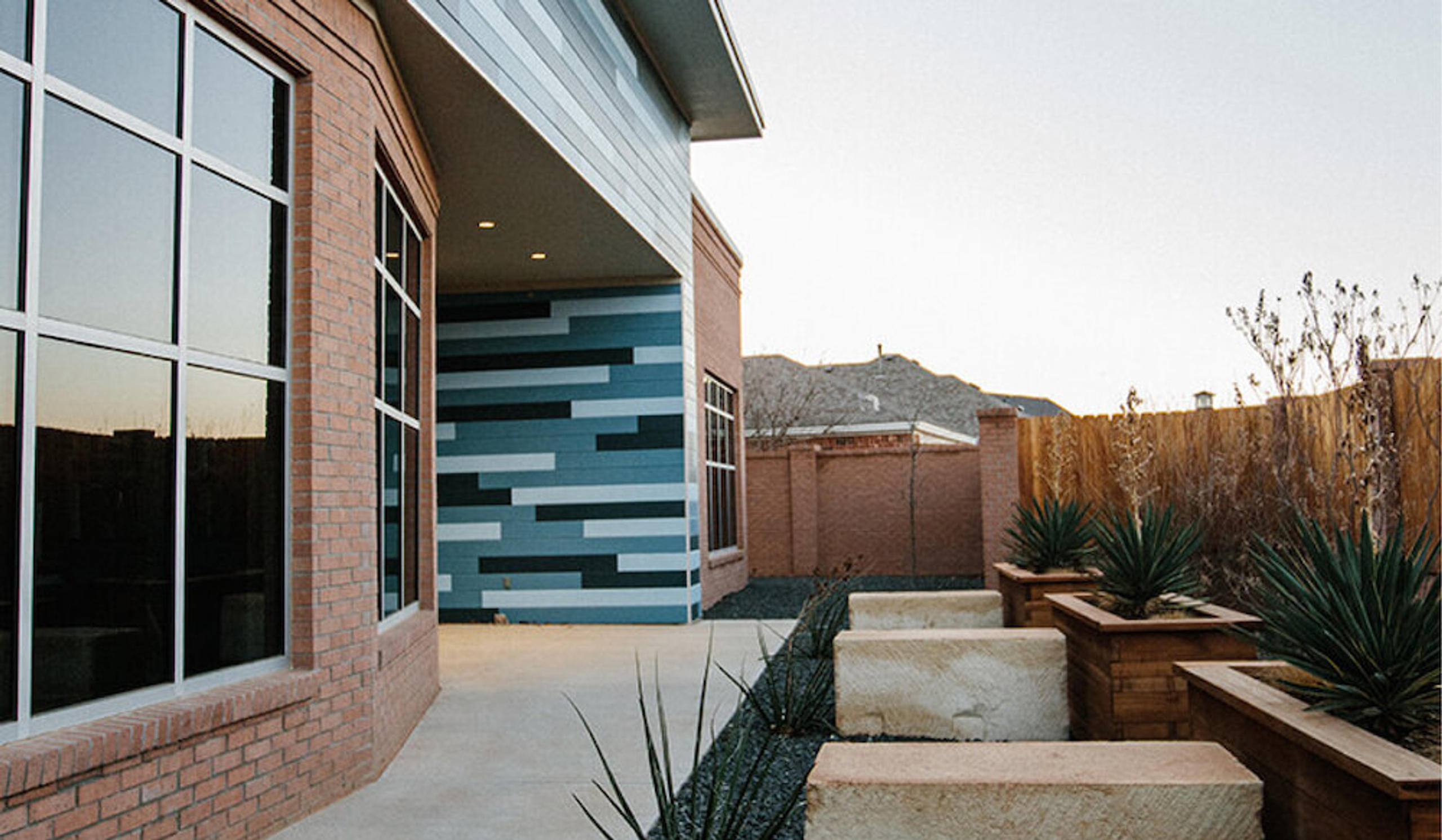 office exterior front yard with plants and seating