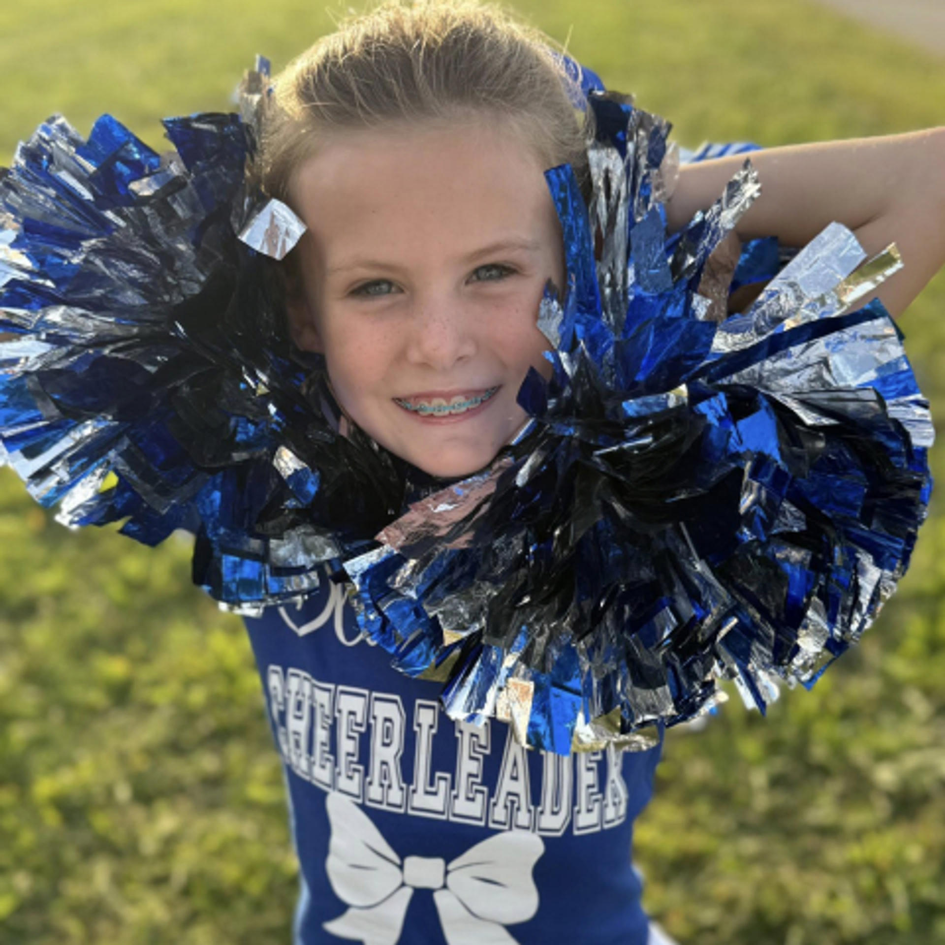 a young cheerleader with braces
