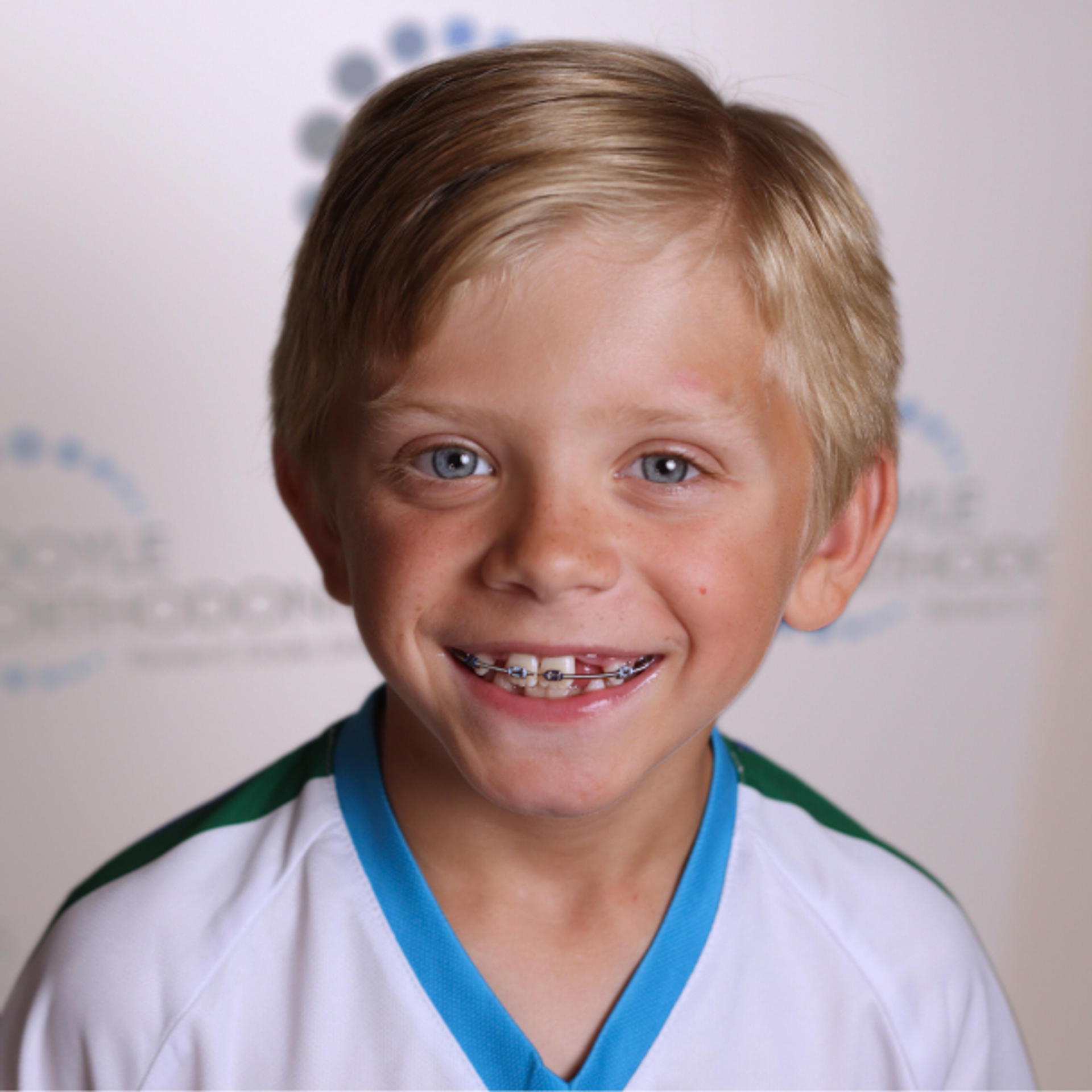 smiling adolescent boy with braces