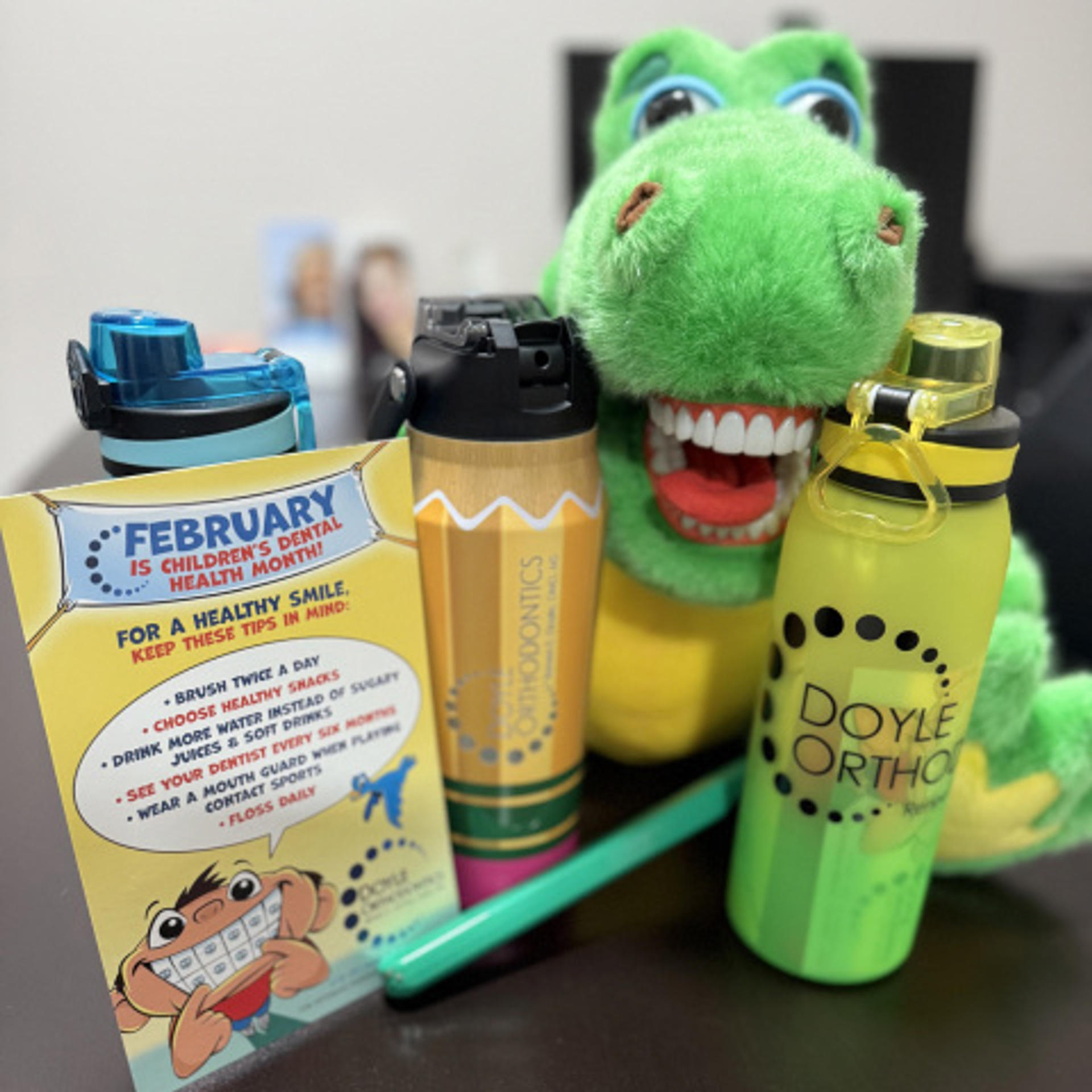 Doyle Ortho swag including water bottles and stuffies