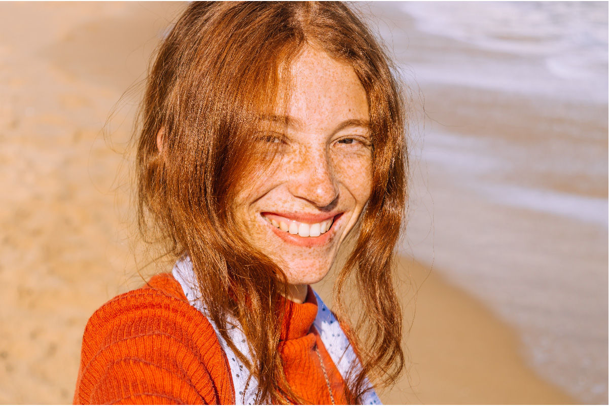 girl laughing in a field