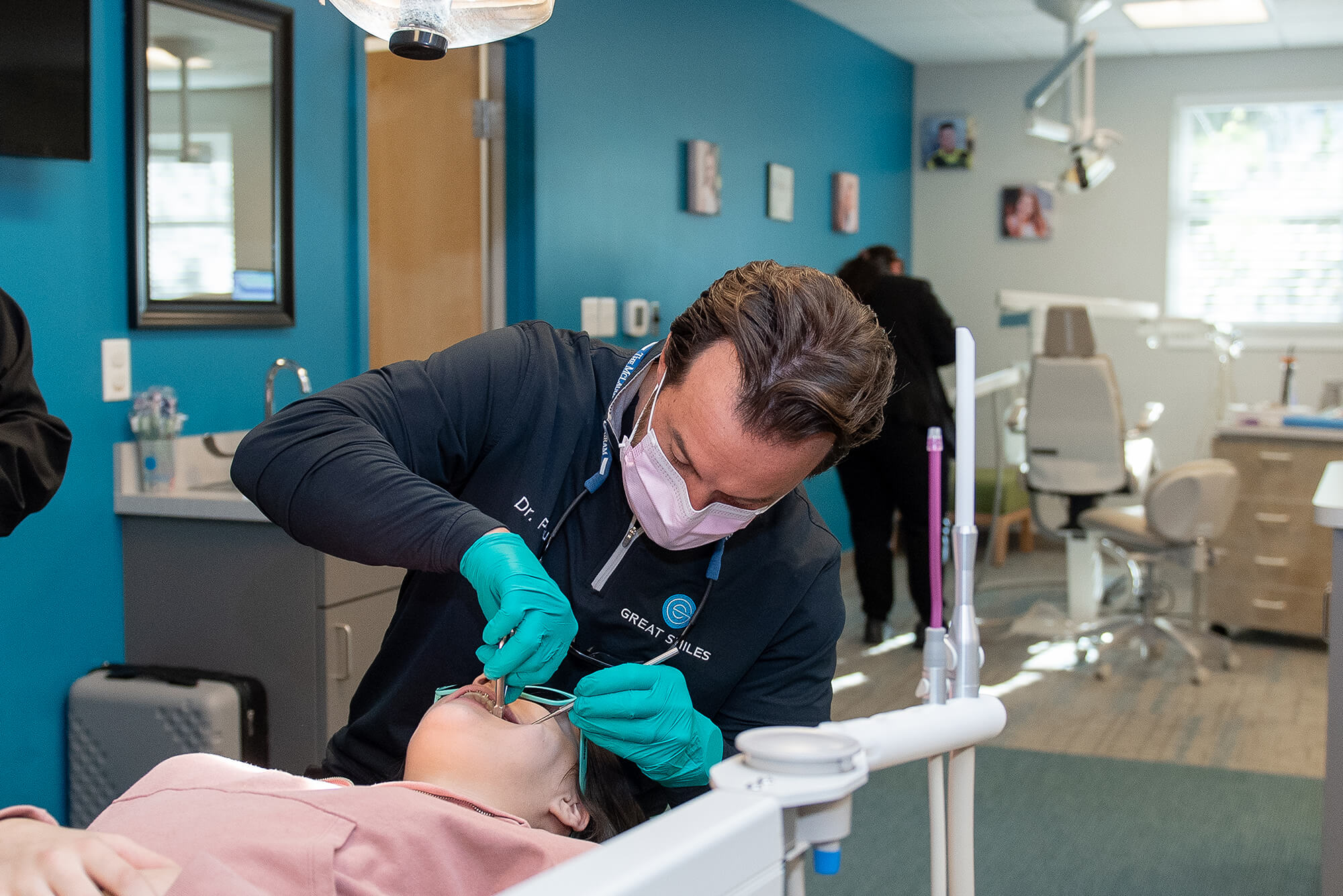 girl holding mouth from tooth pain