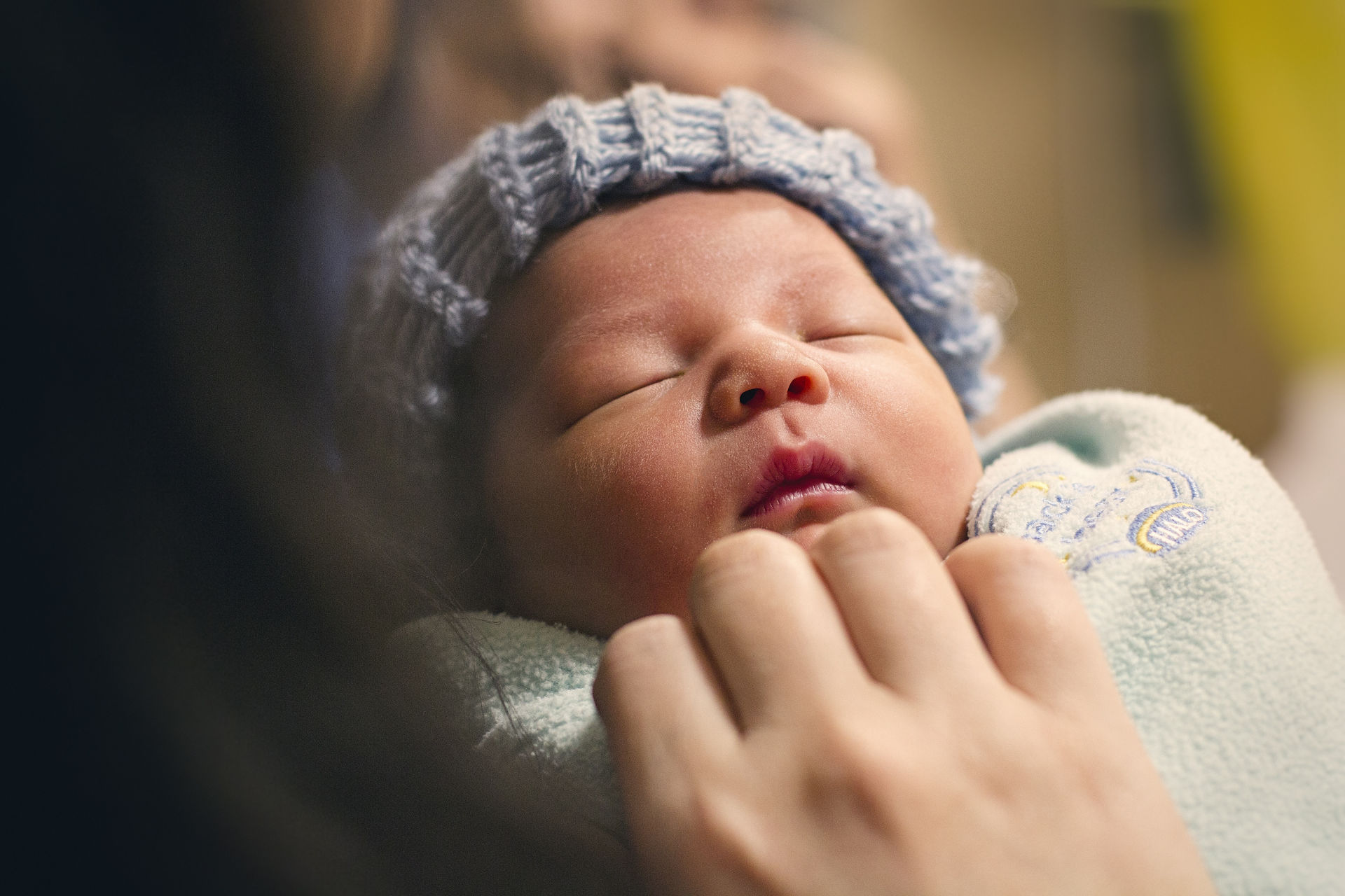 little baby with blue knit hat
