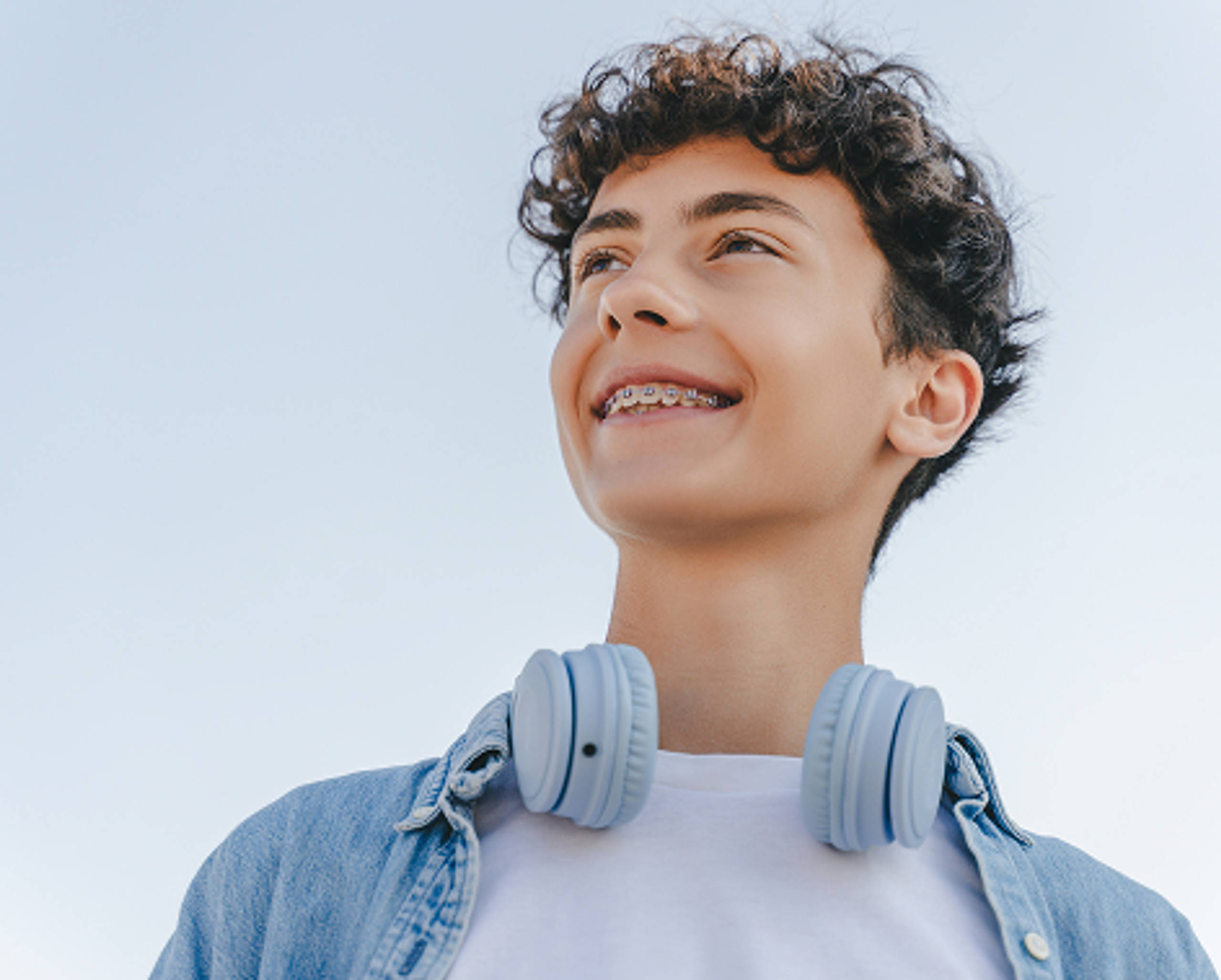 teen with braces smiling