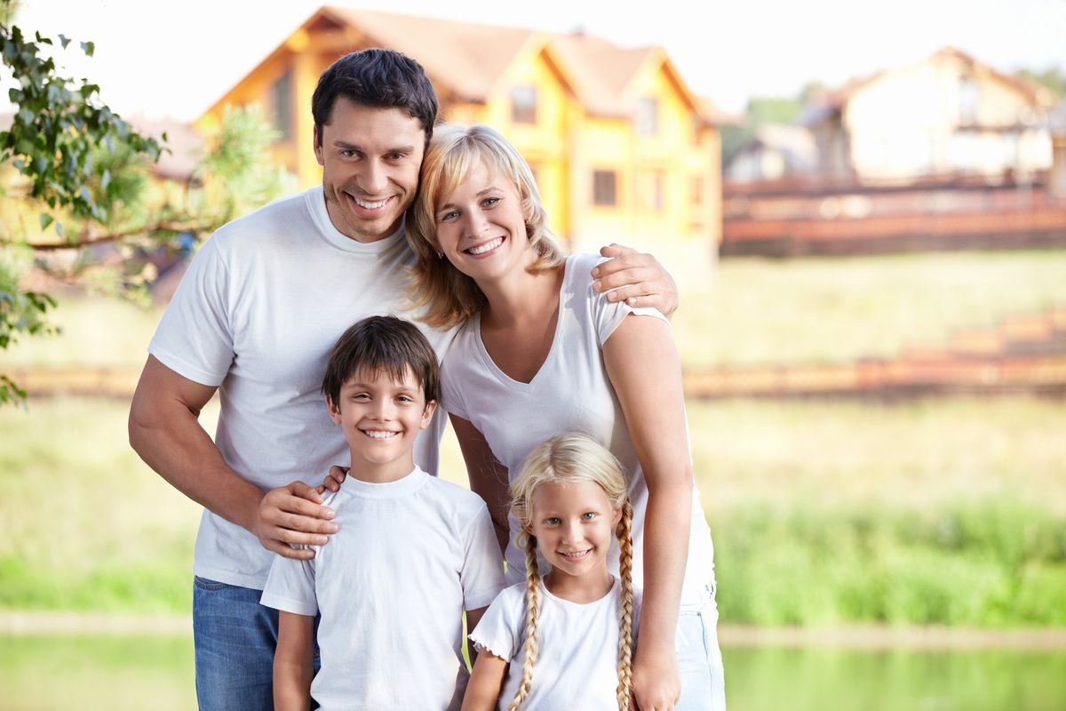 A smiling family outdoors