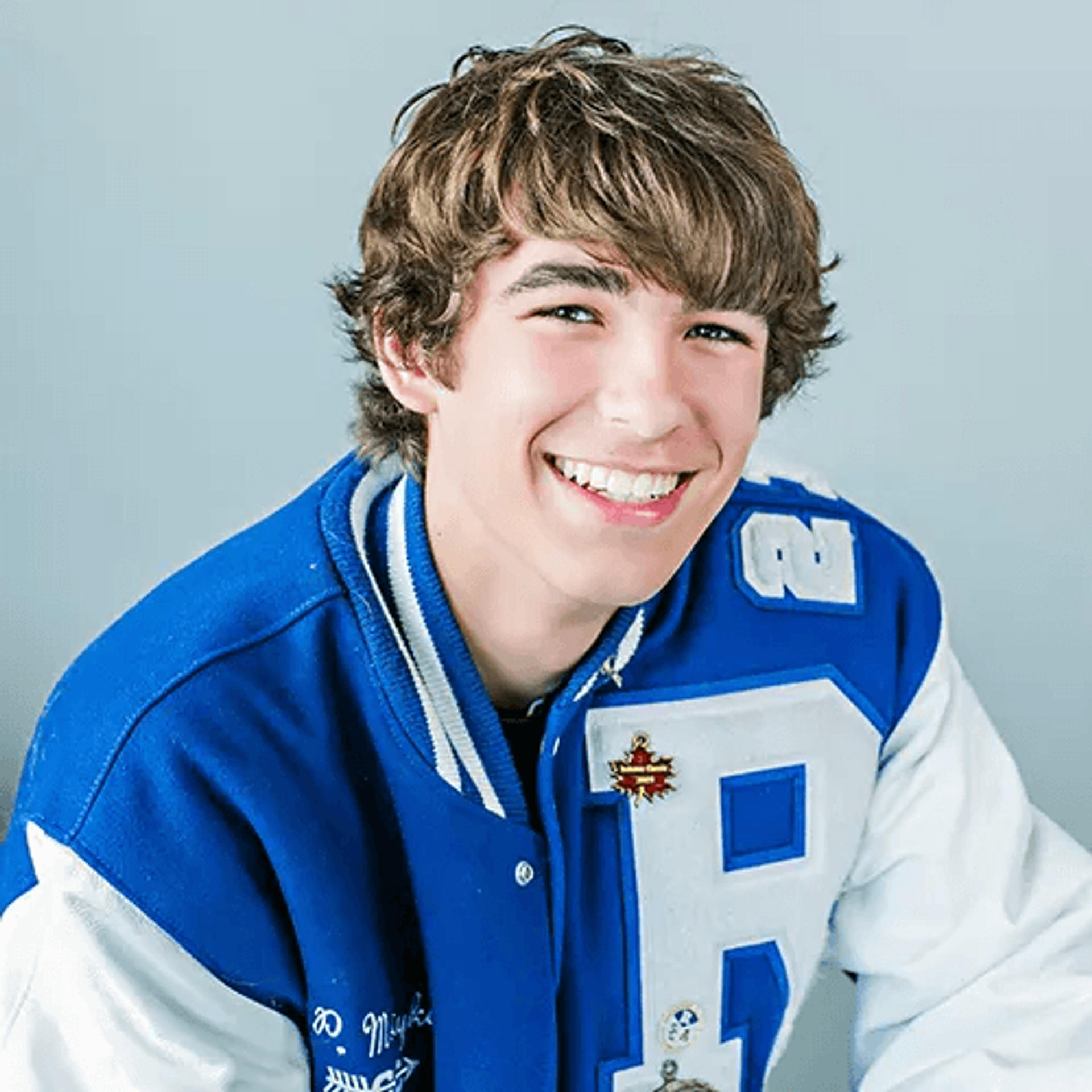 Smiling teen boy ready for same-day orthodontic treatment at Reynolds Orthodontics