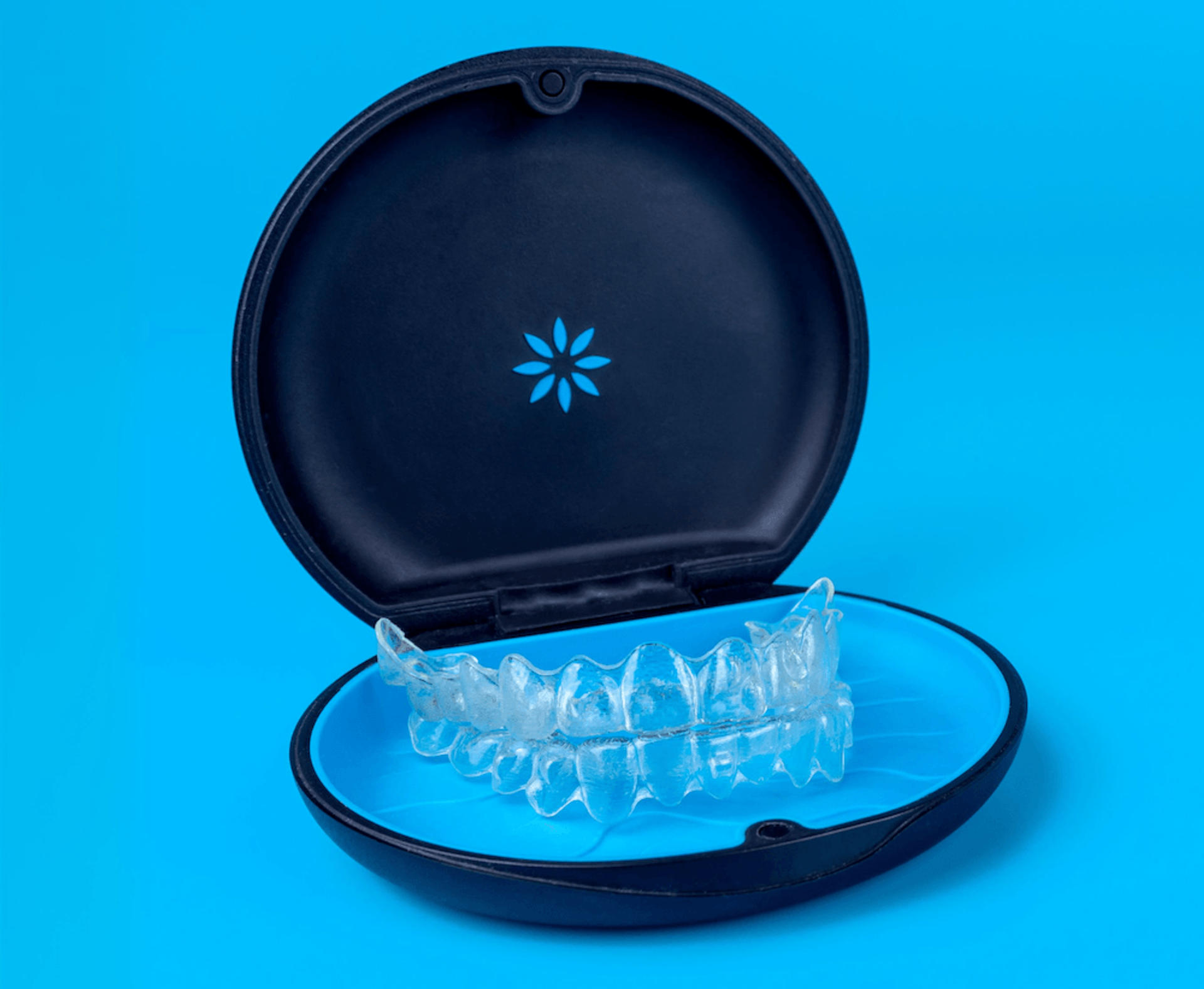 Invisalign aligners in their case — what makes Reynolds Orthodontics Troy different