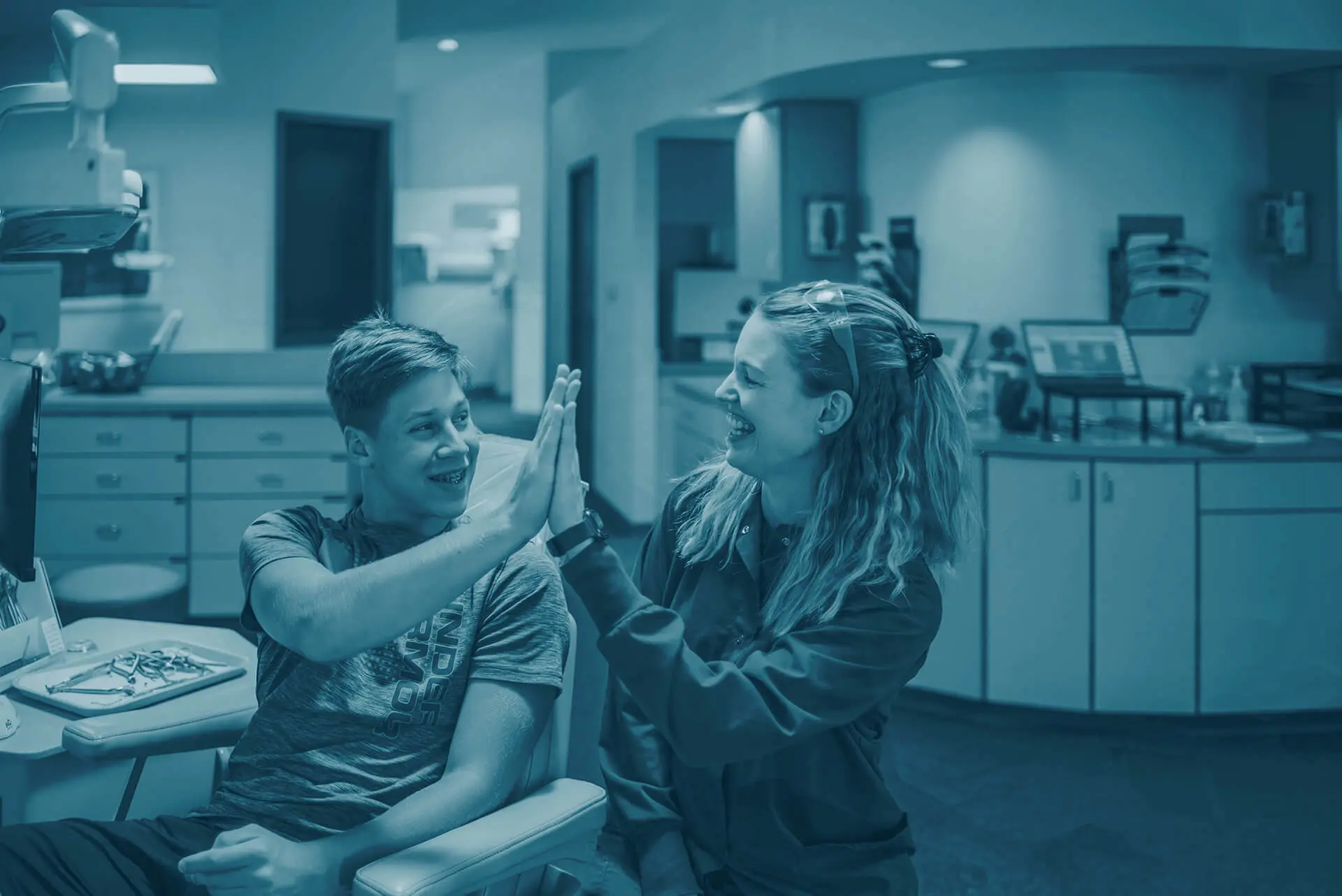 patient giving high five to staff