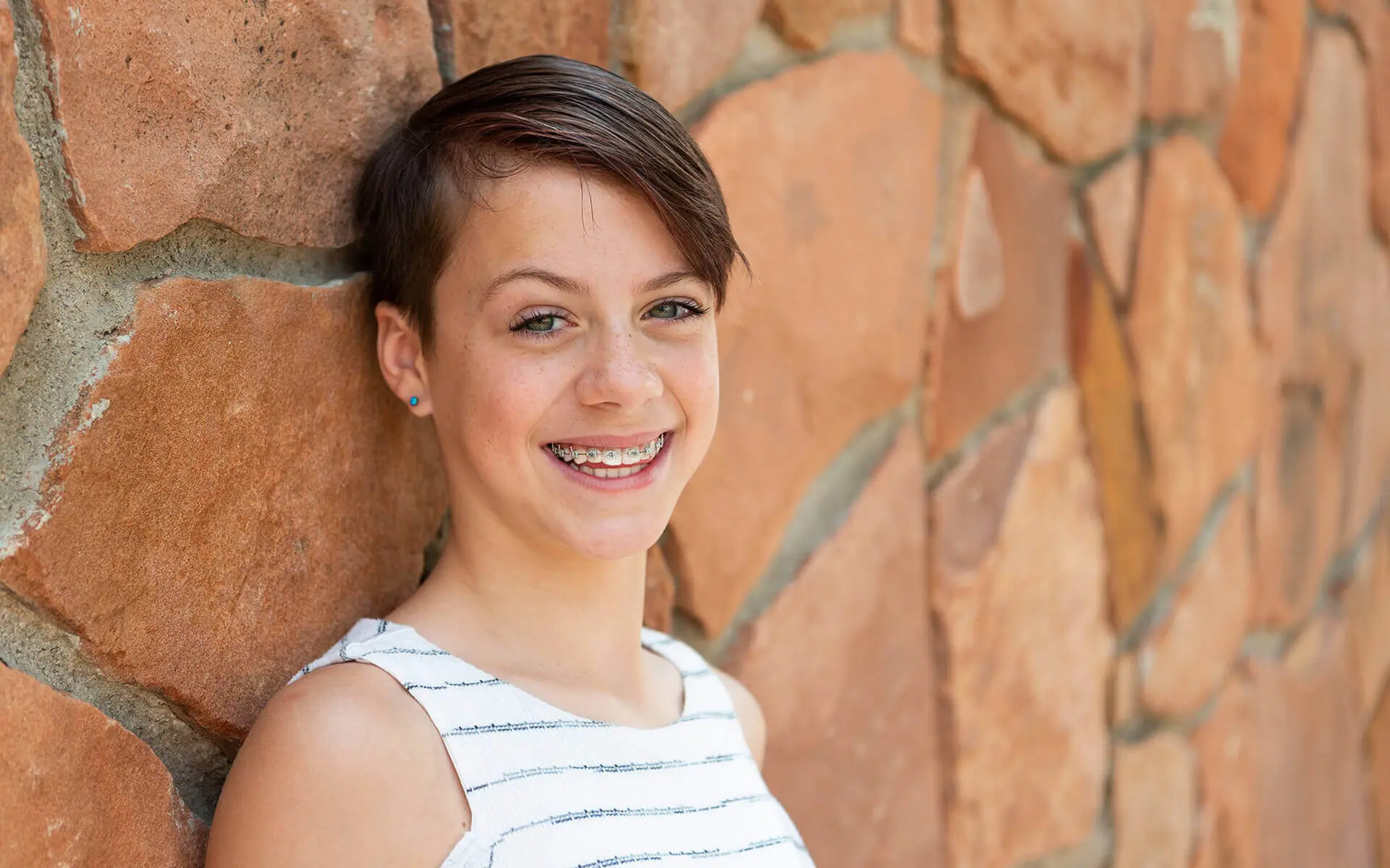 smiling teen boy with braces