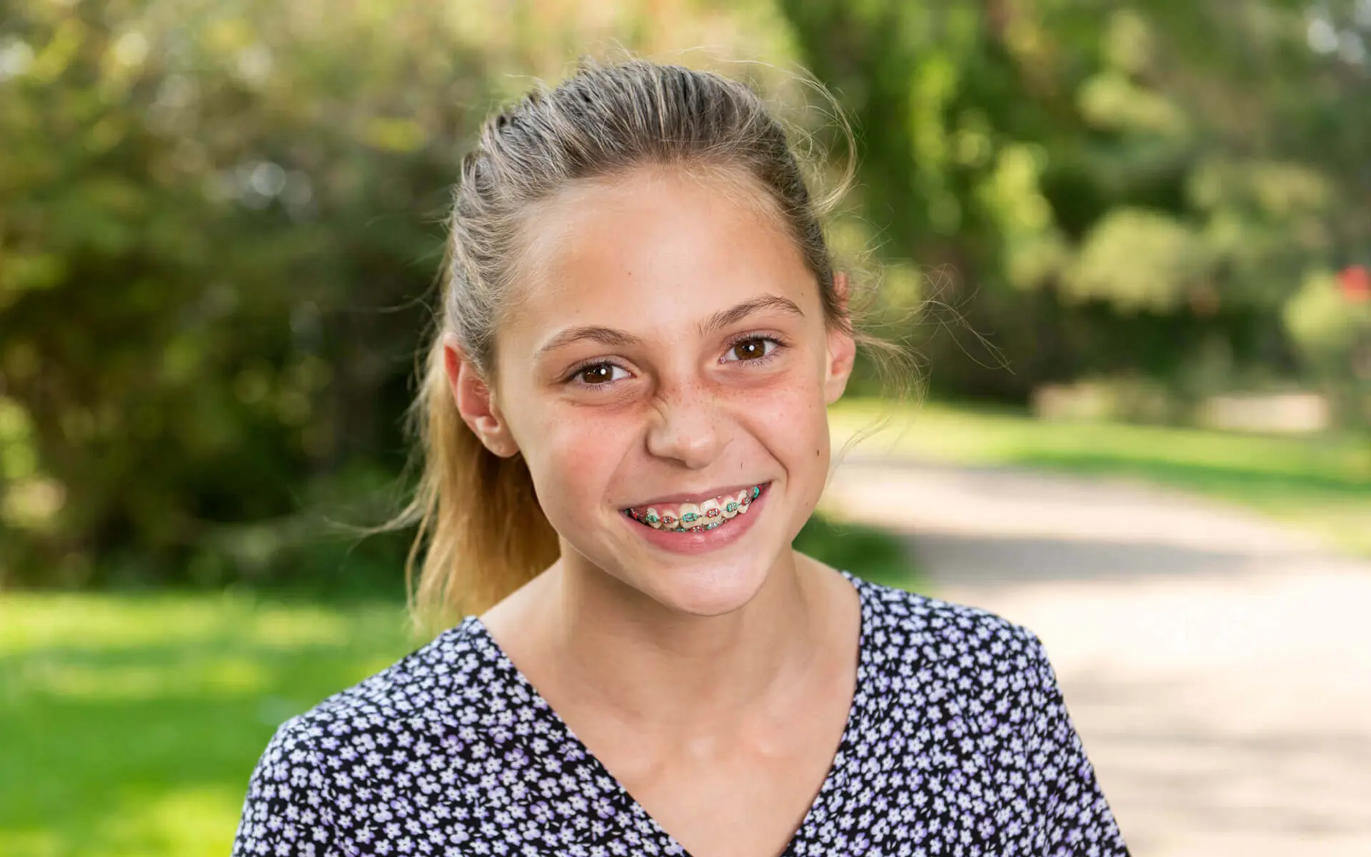 teen girl with braces smiling