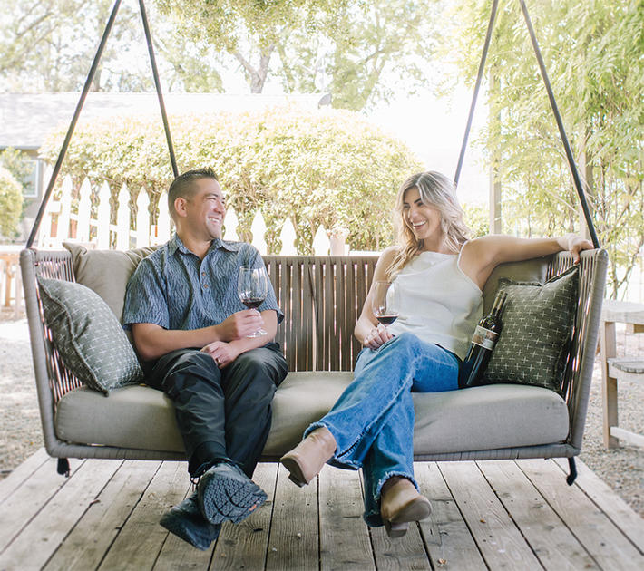 Couple enjoying the bottle service experience at Plumpjack Estate Winery.