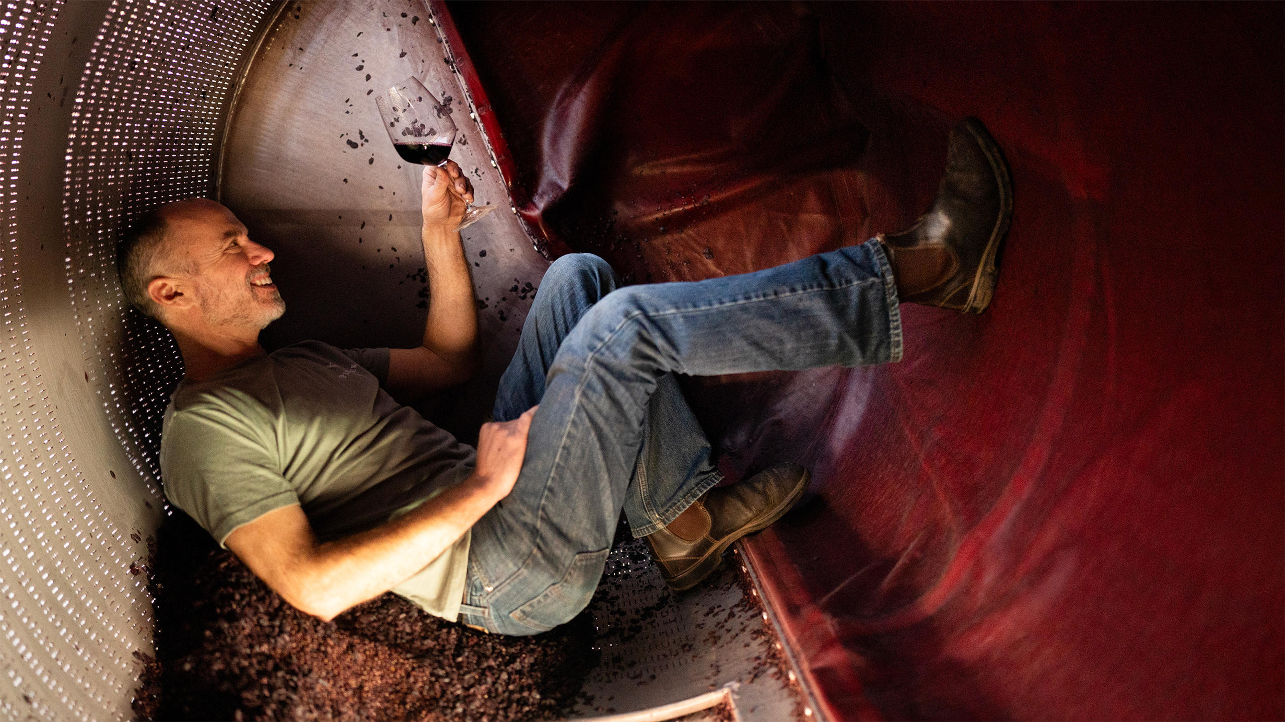 Plumpjack winemaker Aaron Miller sampling some wine.