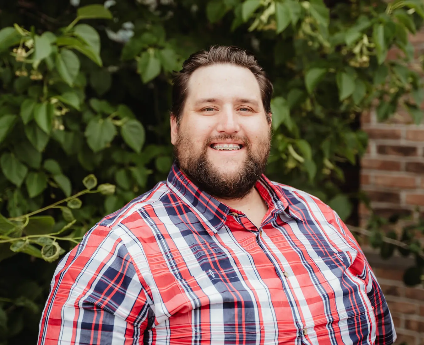 man with braces smiling