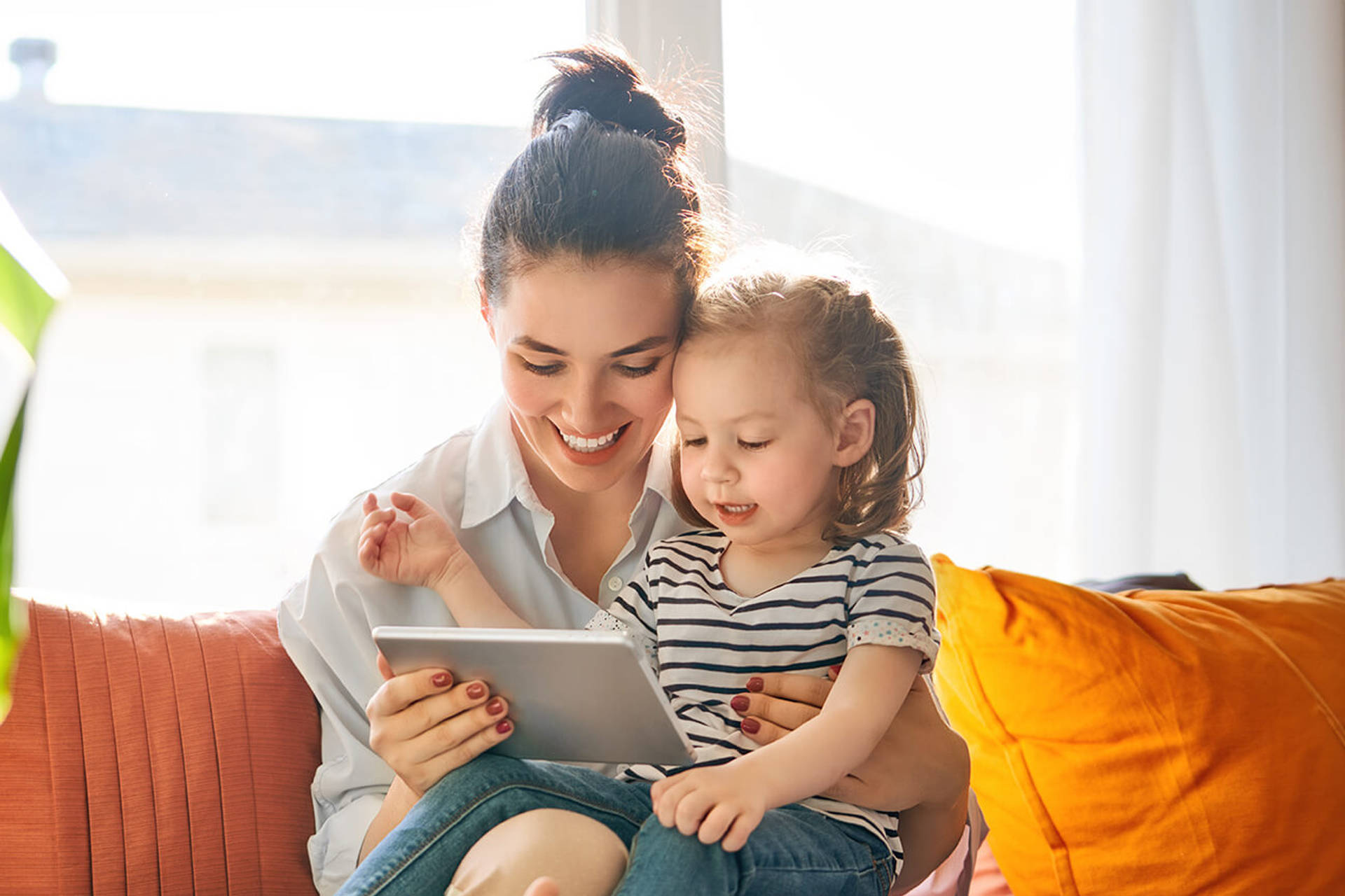 mom and child with tablet