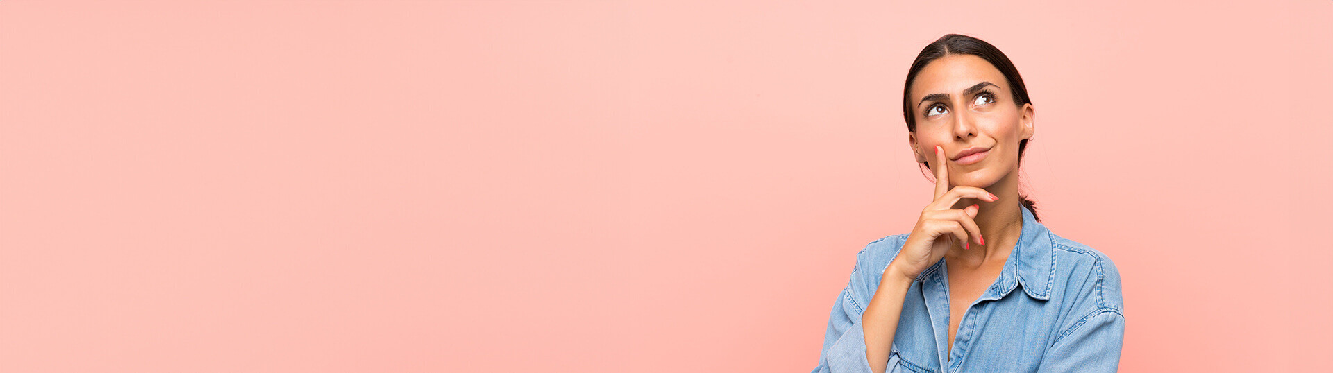 Young woman over isolated pink background thinking an idea