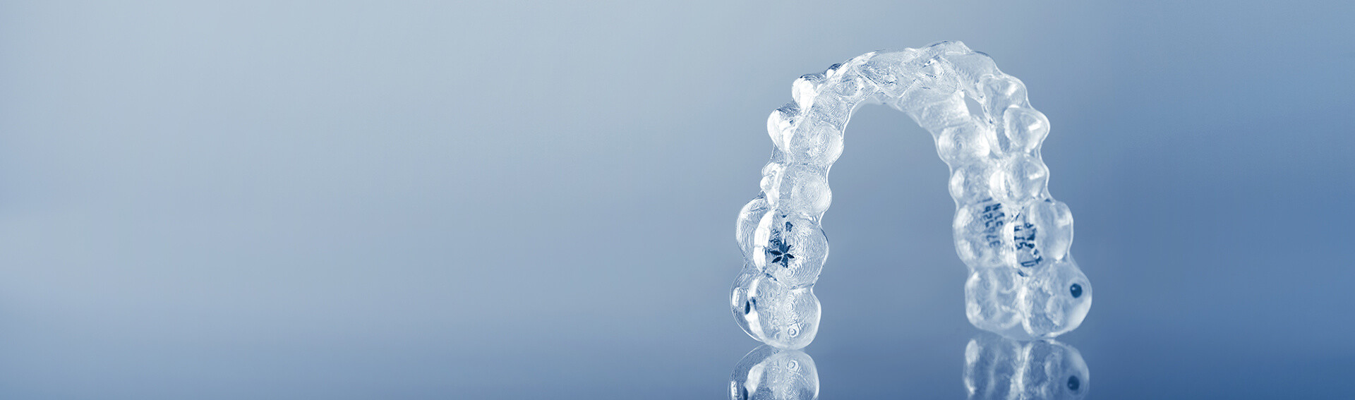 Invisible orthodontics cosmetic brackets, tooth aligners, plastic braces. Modern teeth retainers created on a 3d printer. A way to have a beautiful smile and white teeth.