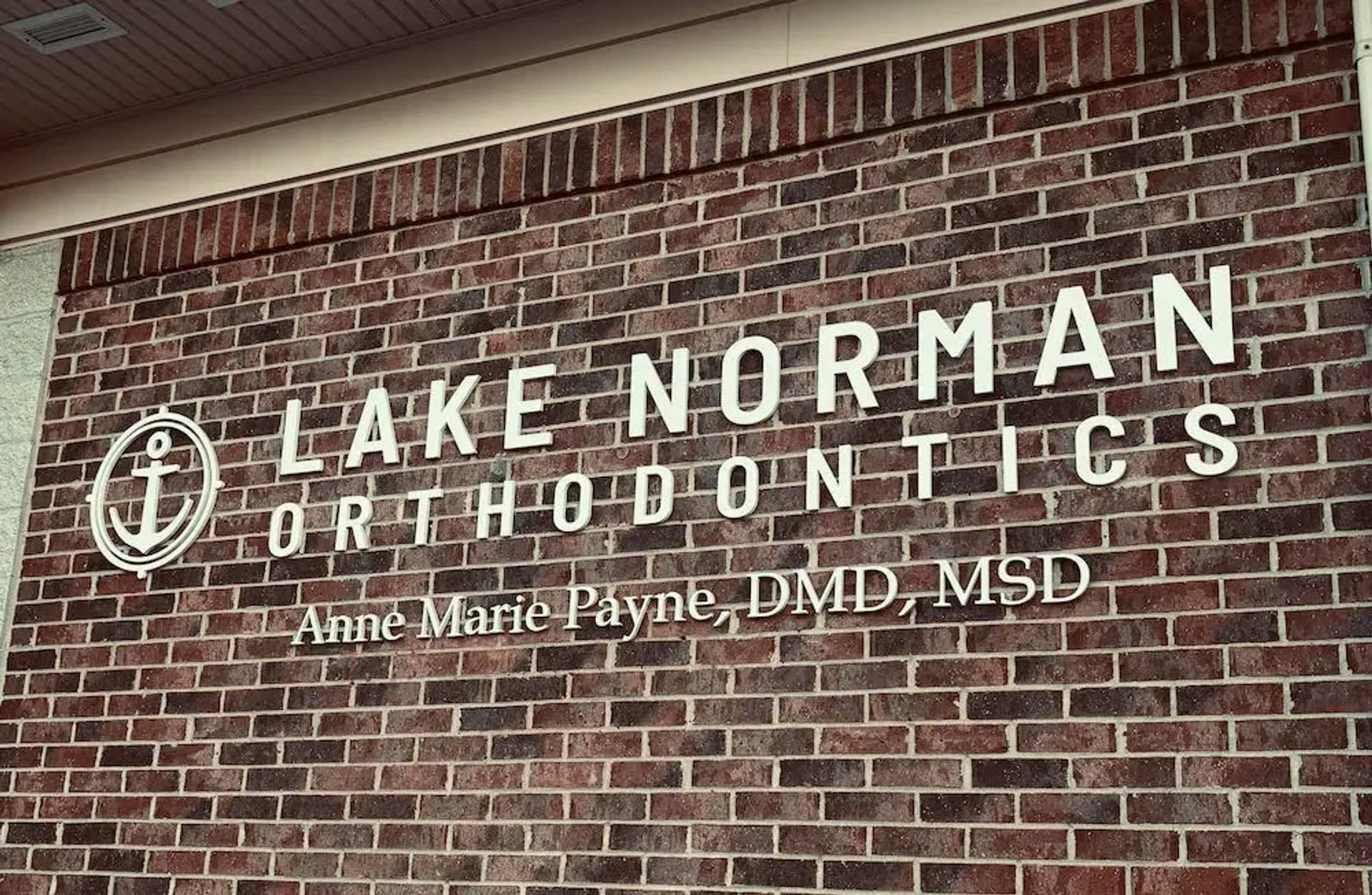 office sign on brick wall