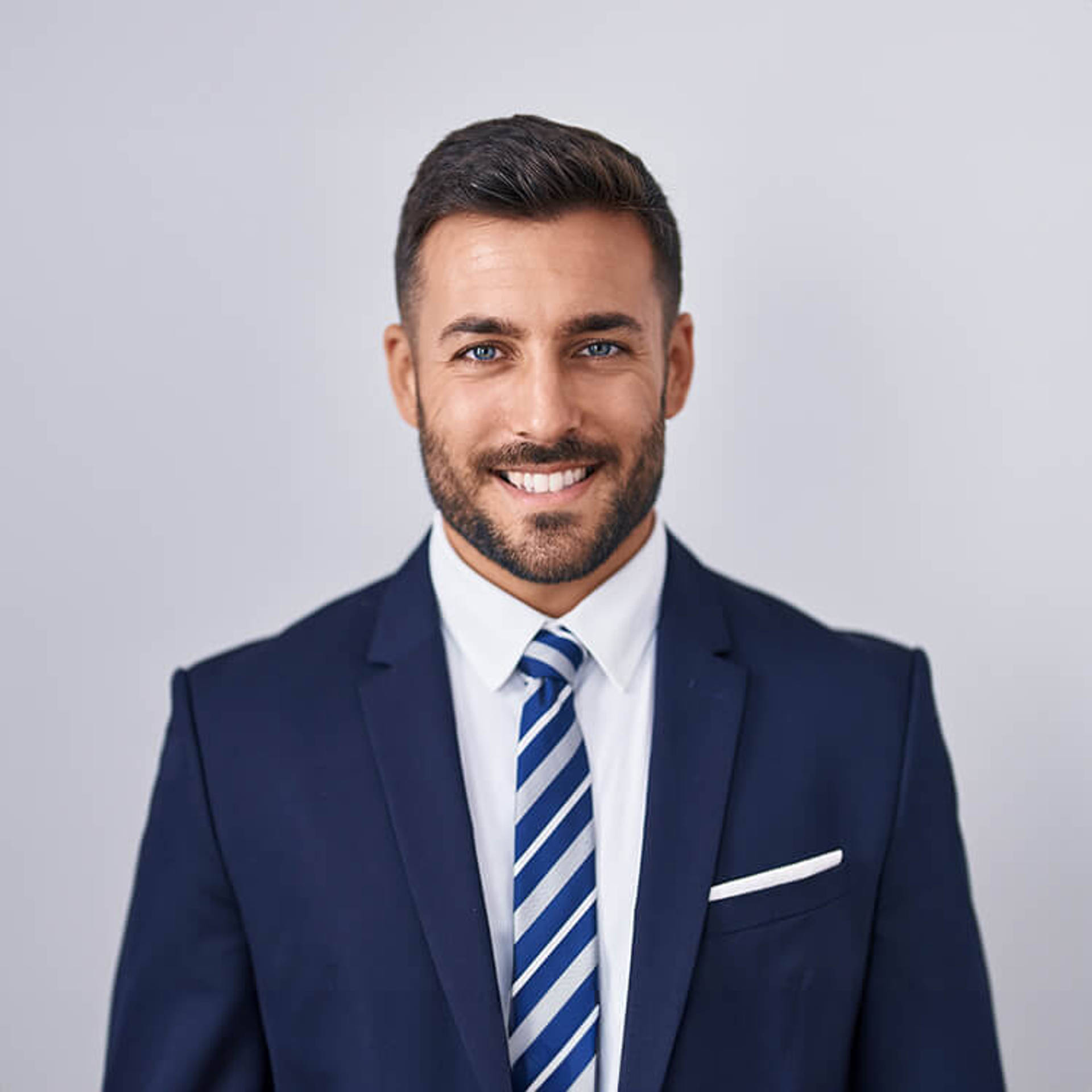 Handsome hispanic man wearing suit and tie with a happy and cool smile on face.