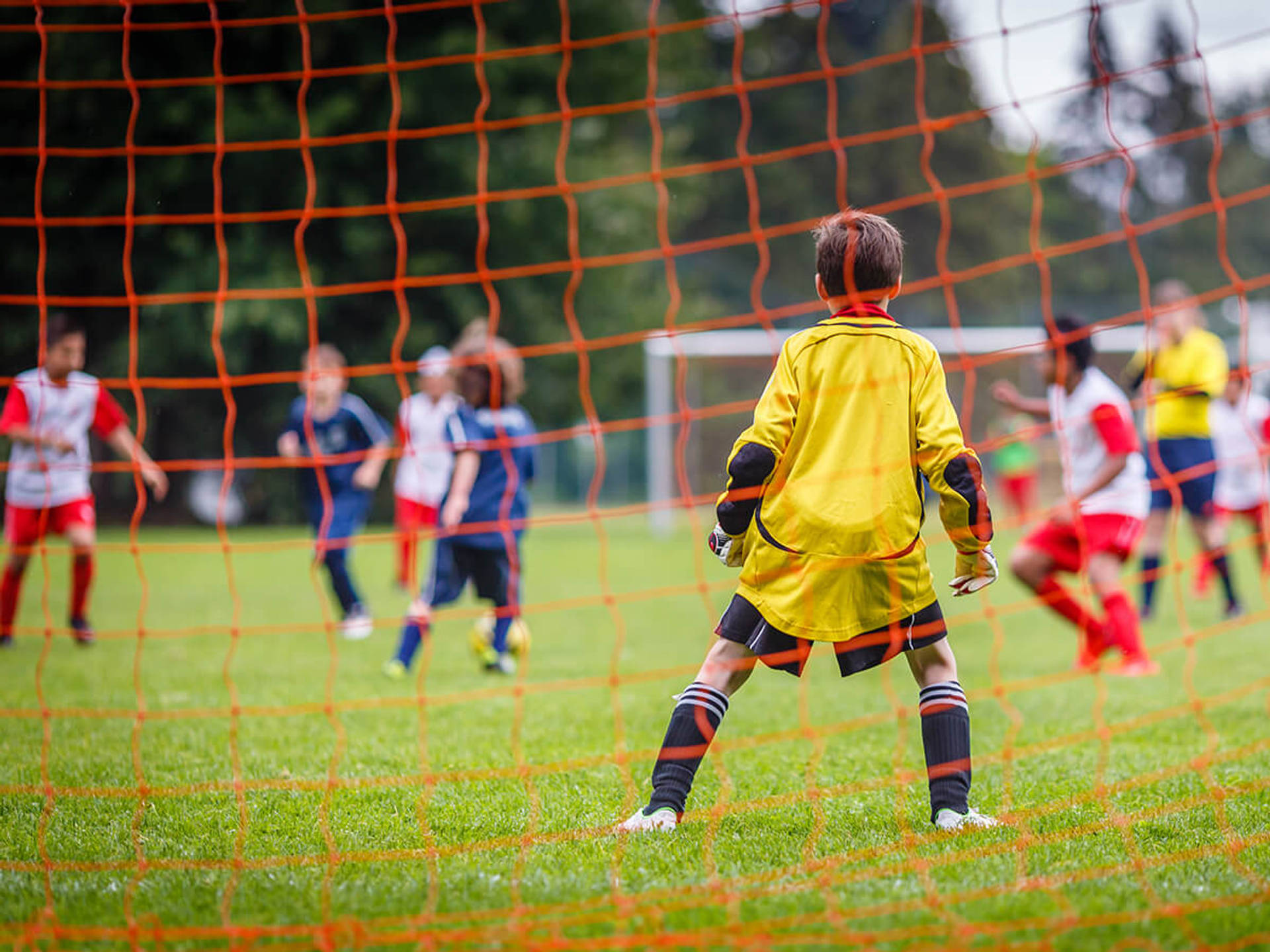 a group of youngsters playing soccer