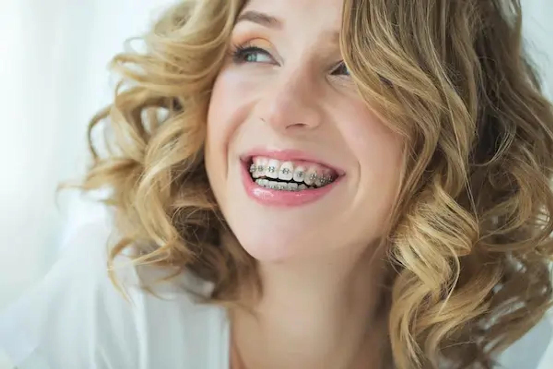 smiling woman with braces