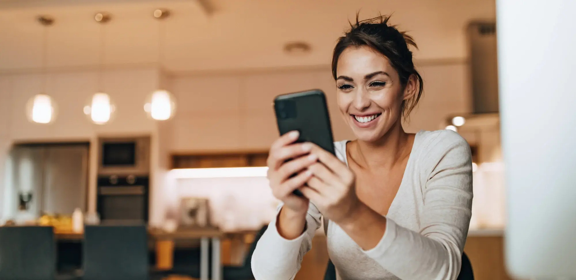 woman smiling on phone