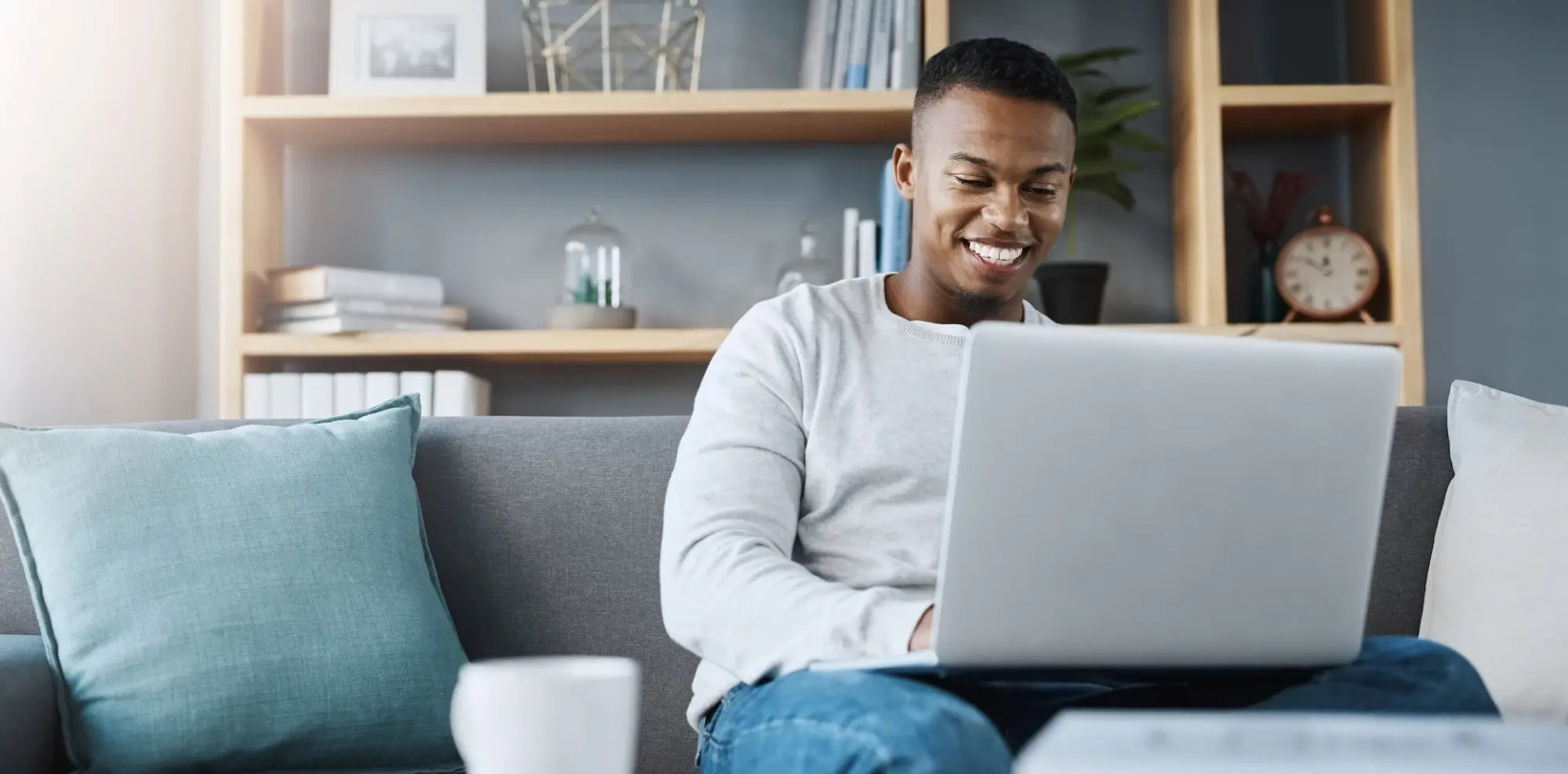 smiling man on laptop