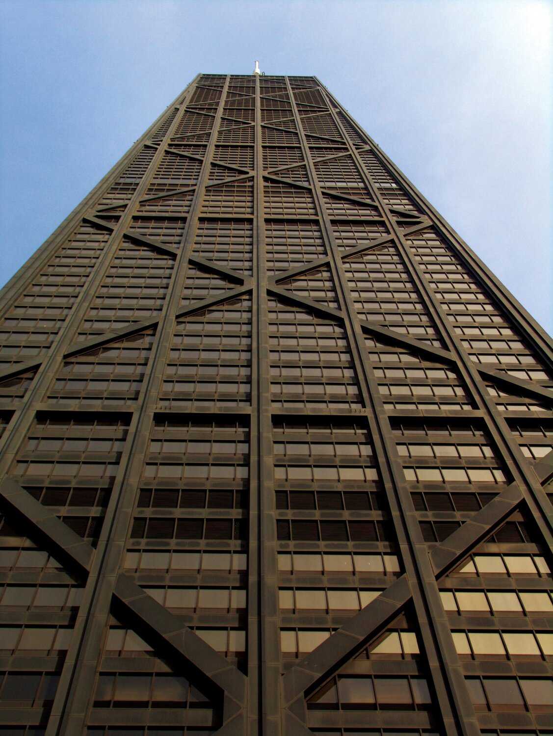 An image of 875 North Michigan avenue taken from below looking up the side of the building