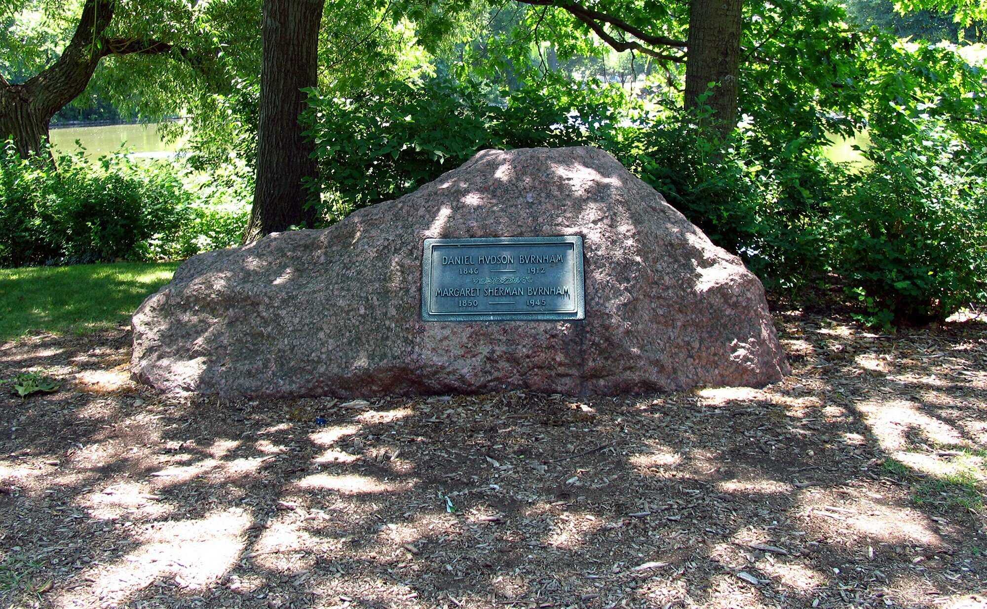 Large rock memorial headstone with engraved plaque