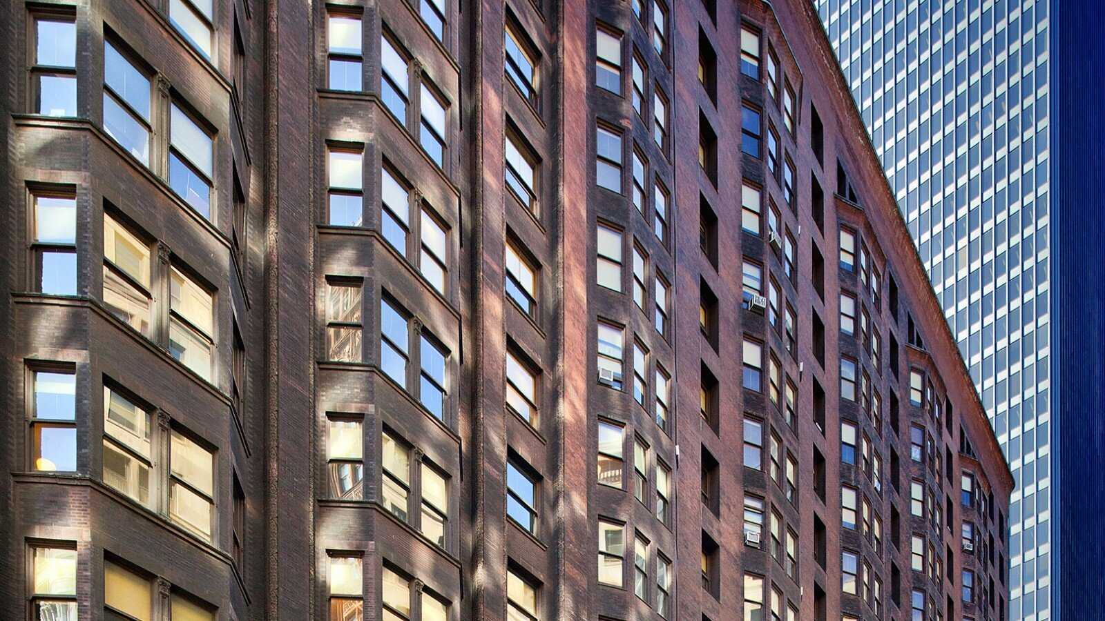 Side view of large brick building with many windows