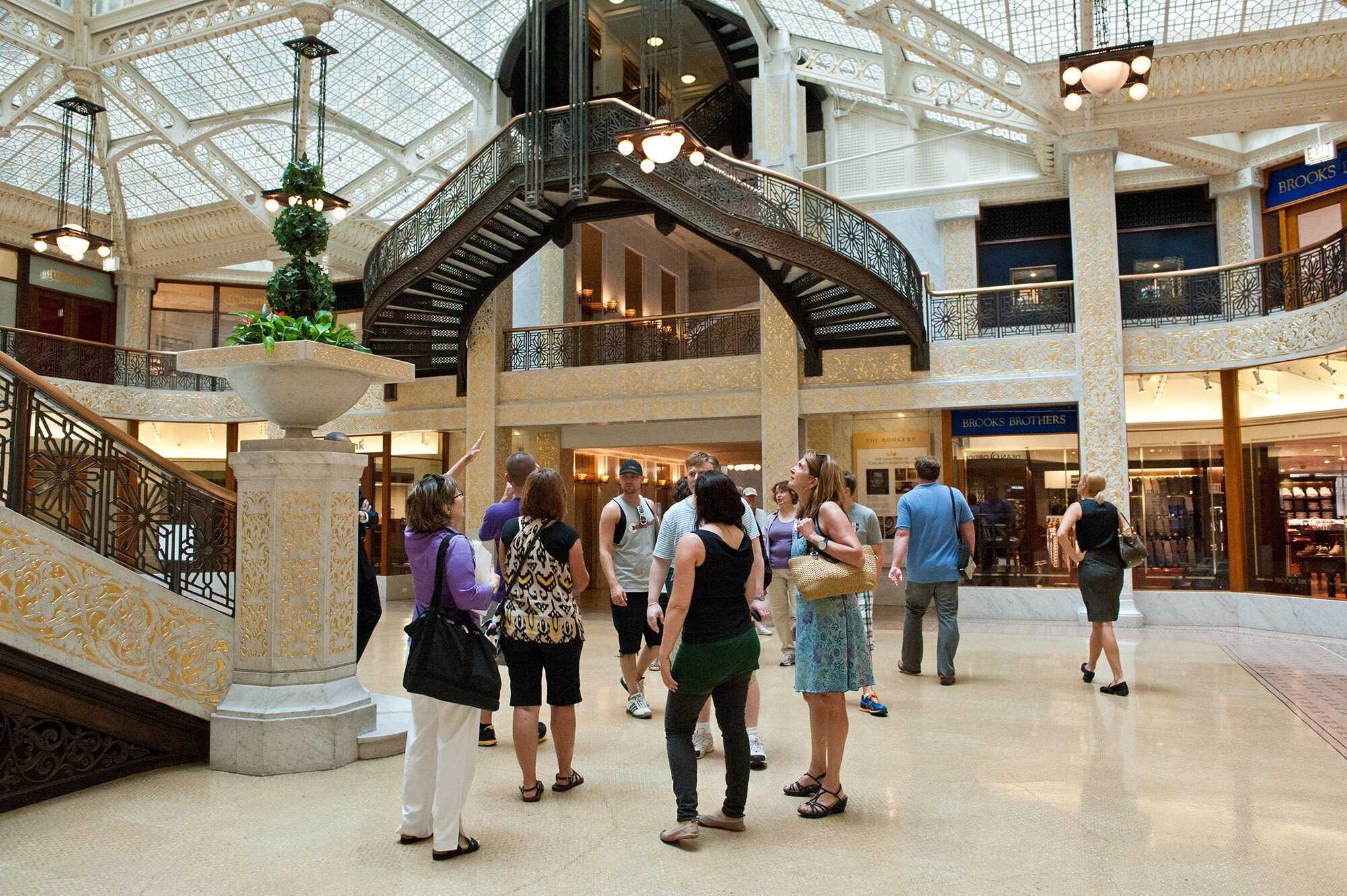 Group of people gathered in building lobby