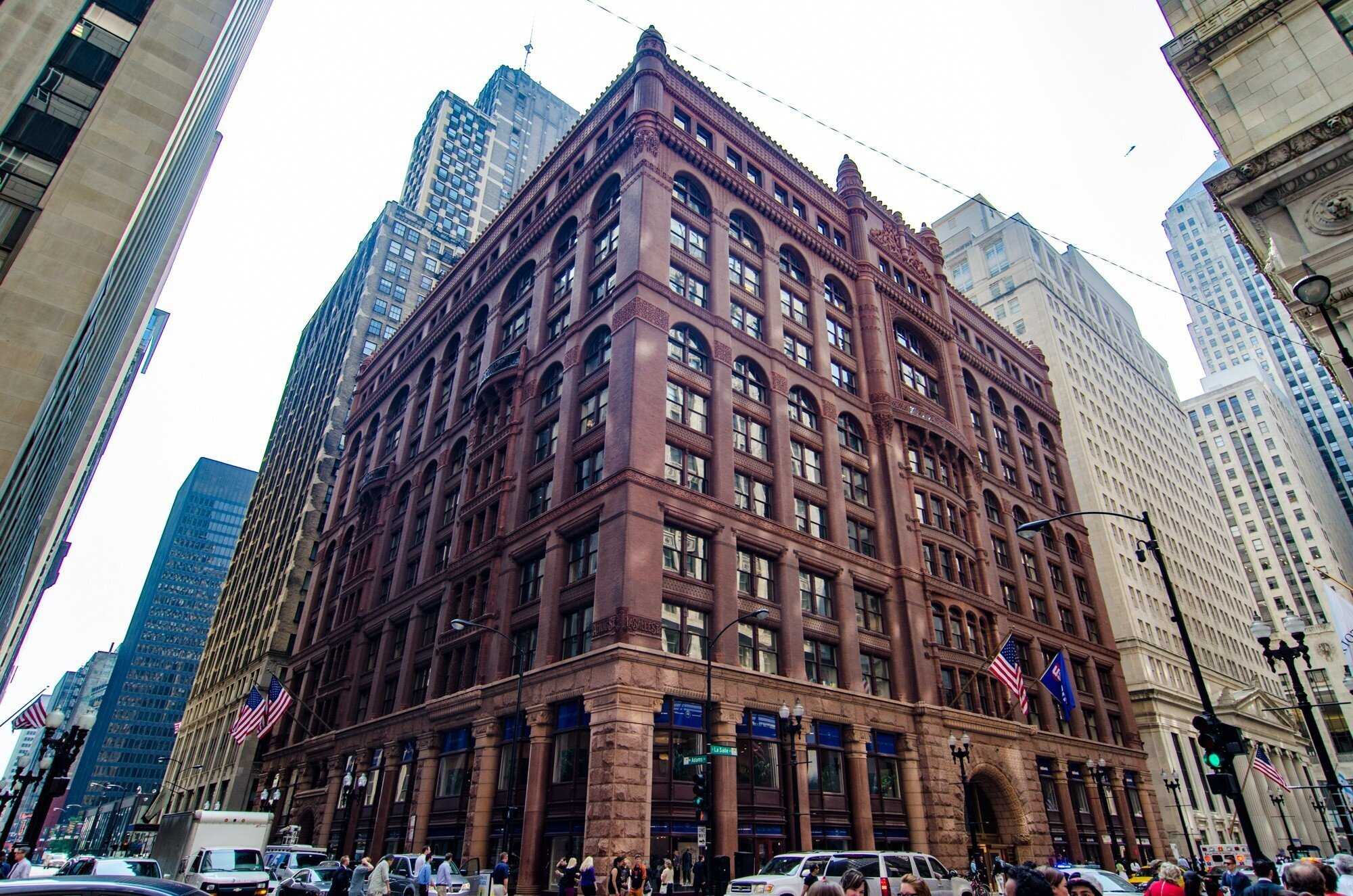 Corner of building with ornate lettering of street names