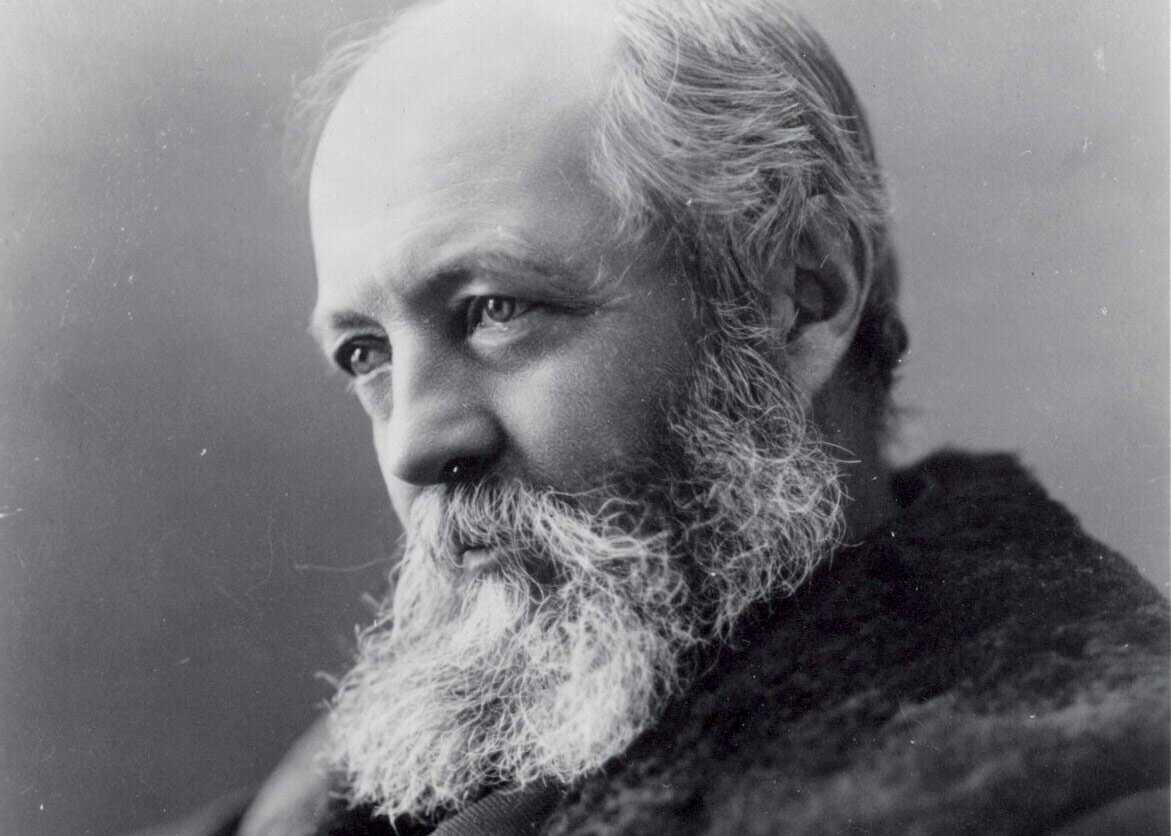 Black and white antique portrait of a bearded older caucasian man.