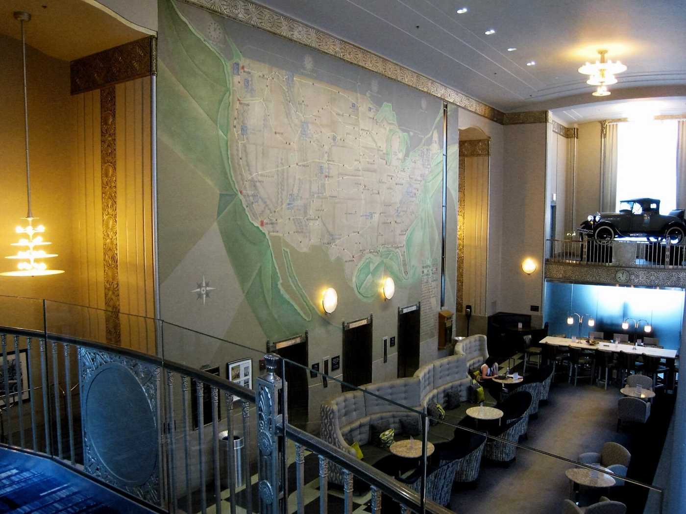 Interior view of 2-story building lobby with large US map on the wall