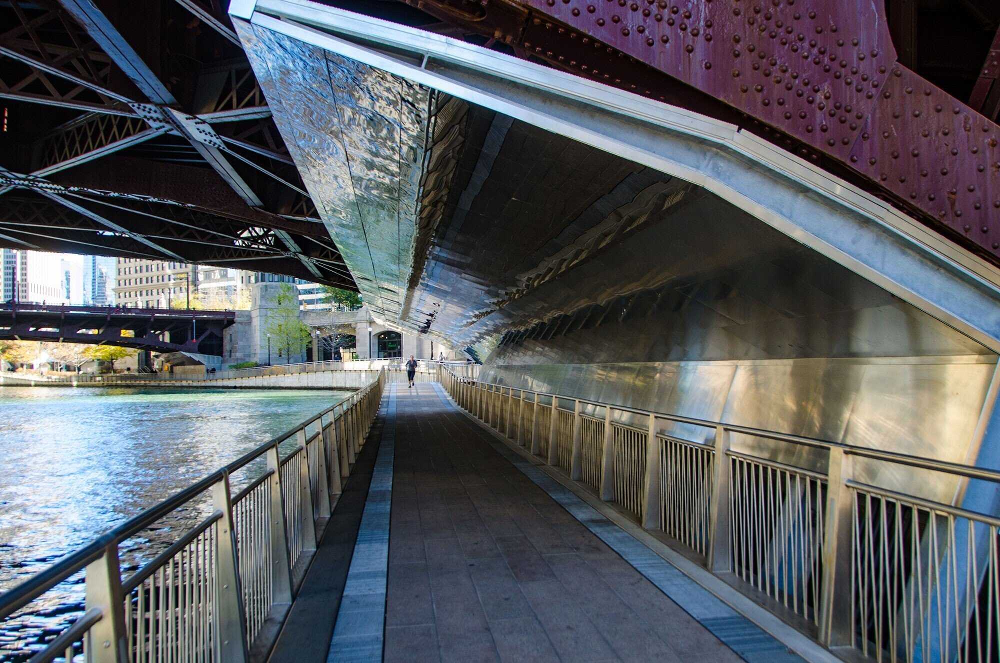 A photo of the Riverwalk under the State Street Bridge