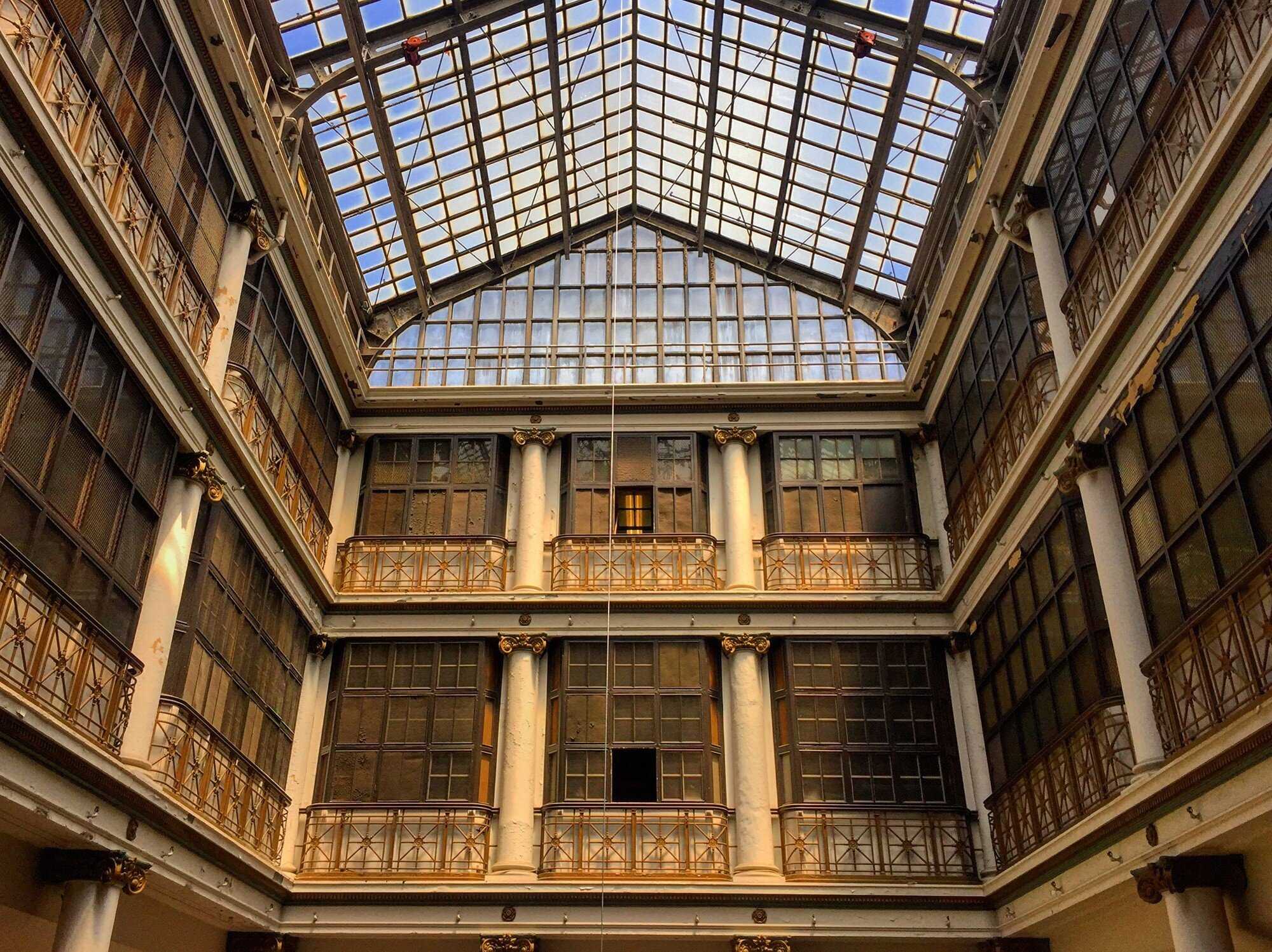 Interior view of building atrium with glass ceiling