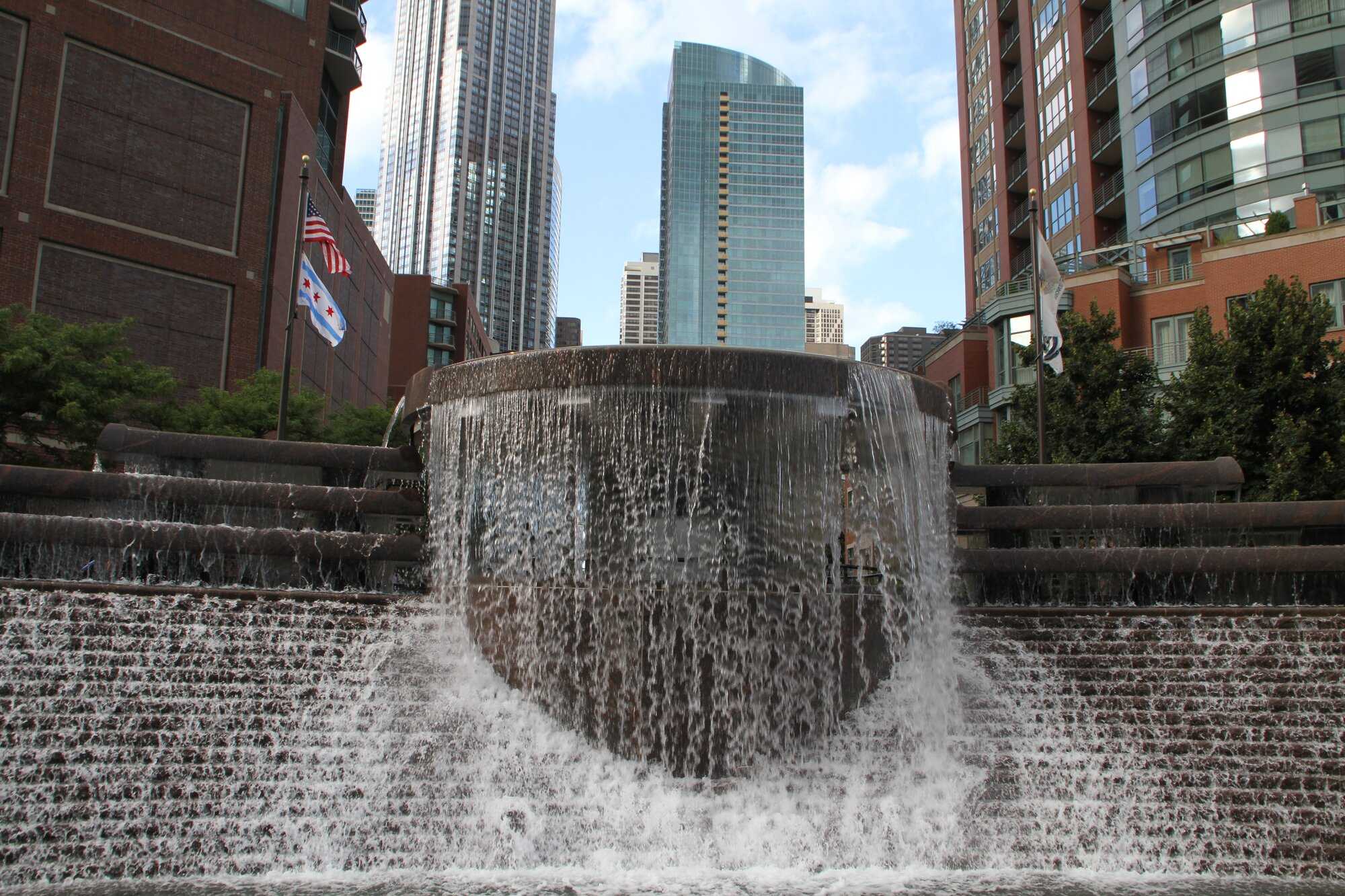 Waterfall-like fountain with skyscrapers in the background